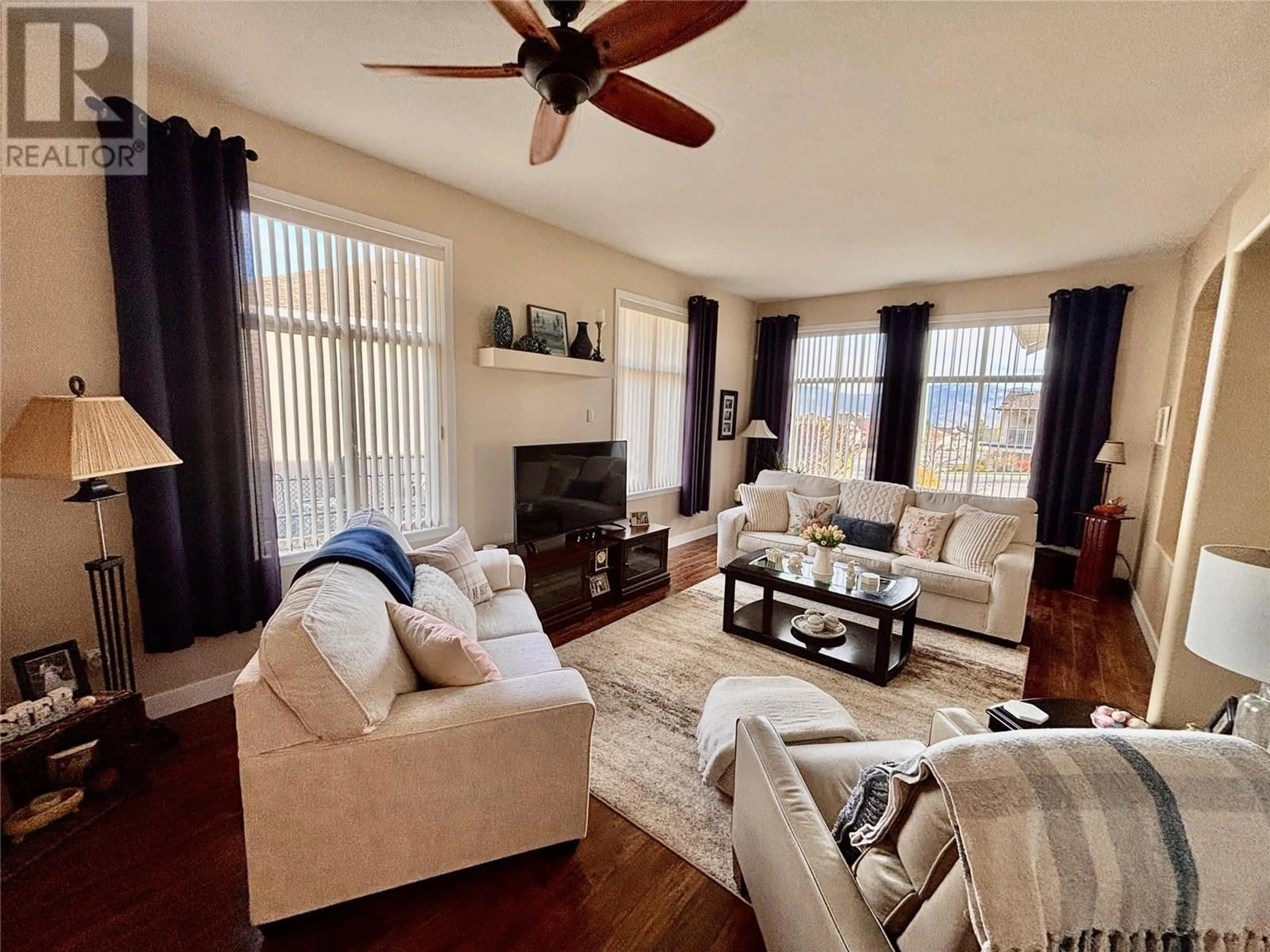 Living room with furniture, wood/laminate floor for 2268 SHANNON HEIGHTS PLACE, West Kelowna British Columbia V4T2V2
