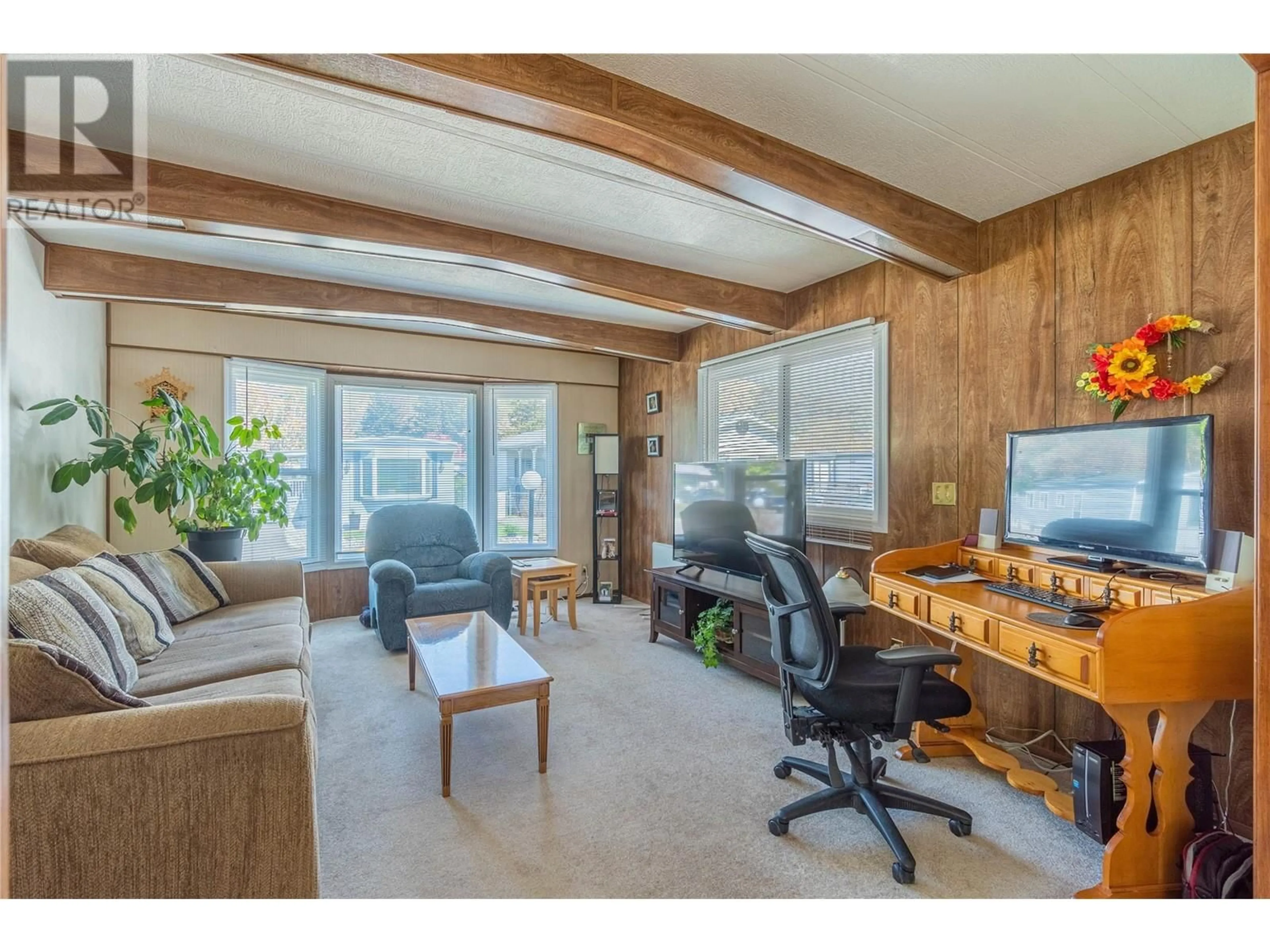 Living room with furniture, wood/laminate floor for 98 - 2401 ORD ROAD, Kamloops British Columbia V2B7V8