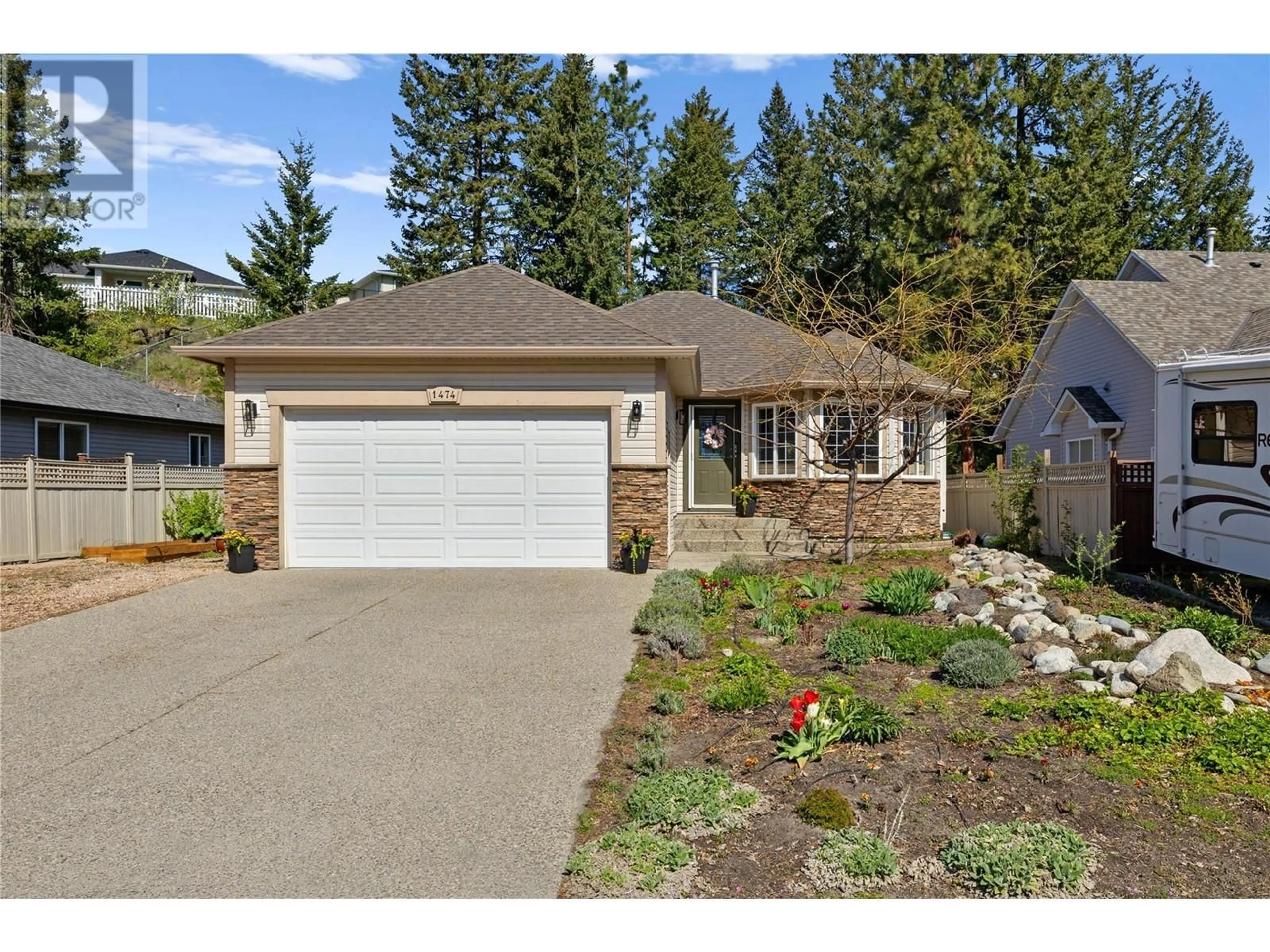 Home with vinyl exterior material, street for 1474 ROSE MEADOW DRIVE, West Kelowna British Columbia V1Z4A3