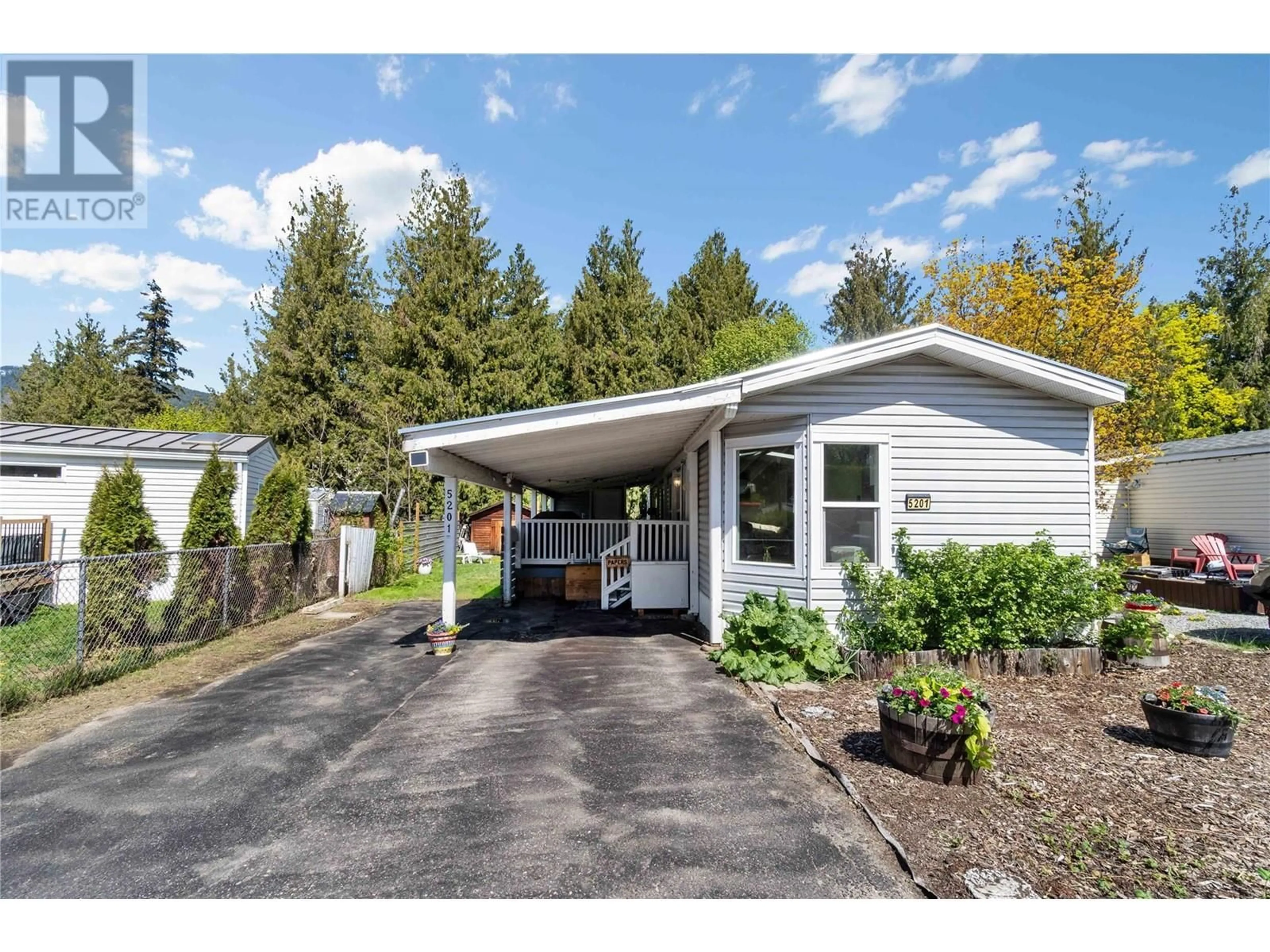Home with vinyl exterior material, street for 5201 67 AVENUE NORTHEAST, Canoe British Columbia V0E1K0