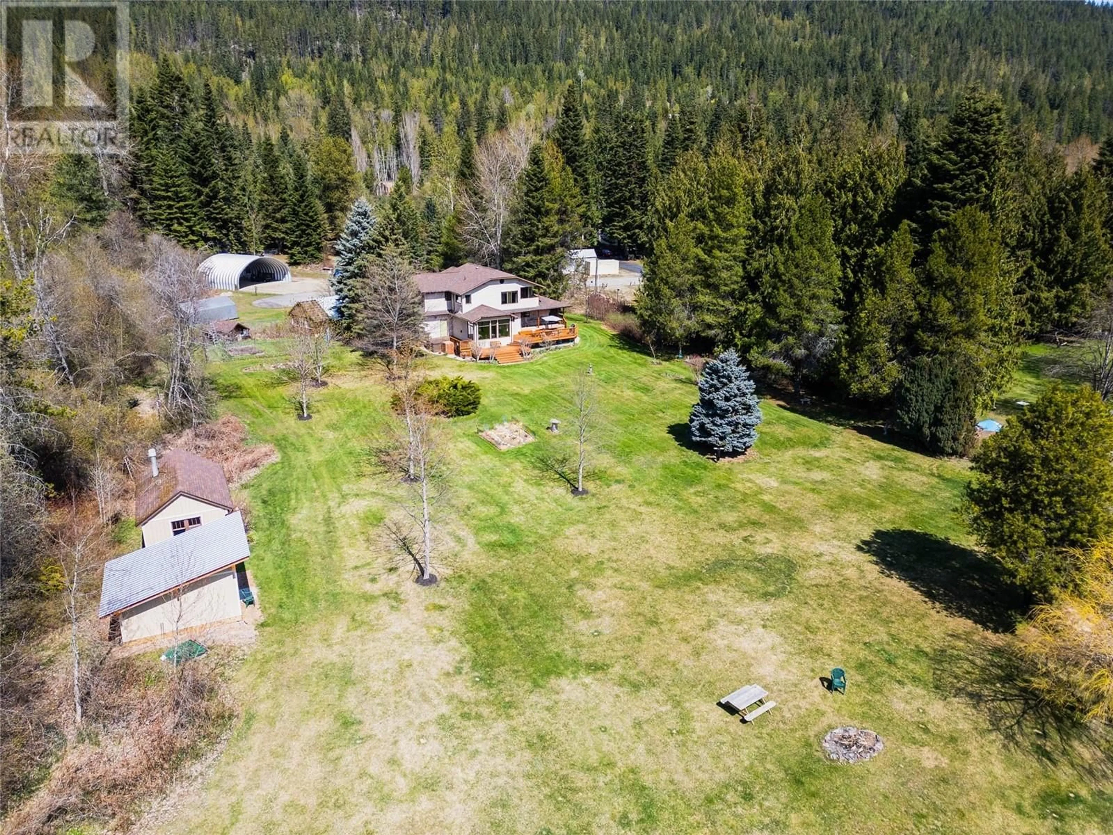 A pic from outside/outdoor area/front of a property/back of a property/a pic from drone, forest/trees view for 6158 REDFISH ROAD, Nelson British Columbia V1L6M9