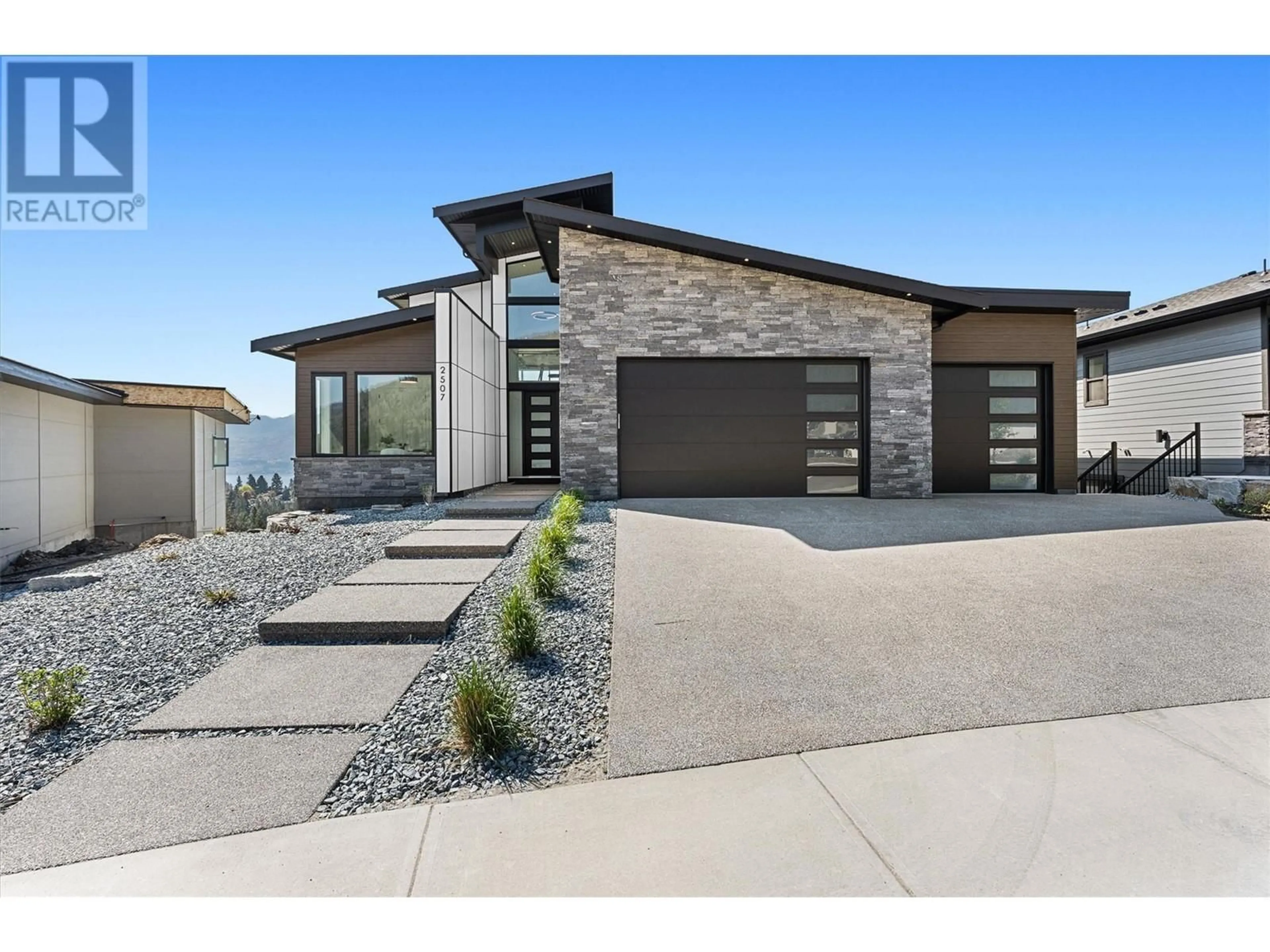 Home with brick exterior material, street for 2507 PINNACLE RIDGE DRIVE, West Kelowna British Columbia V4T0E3