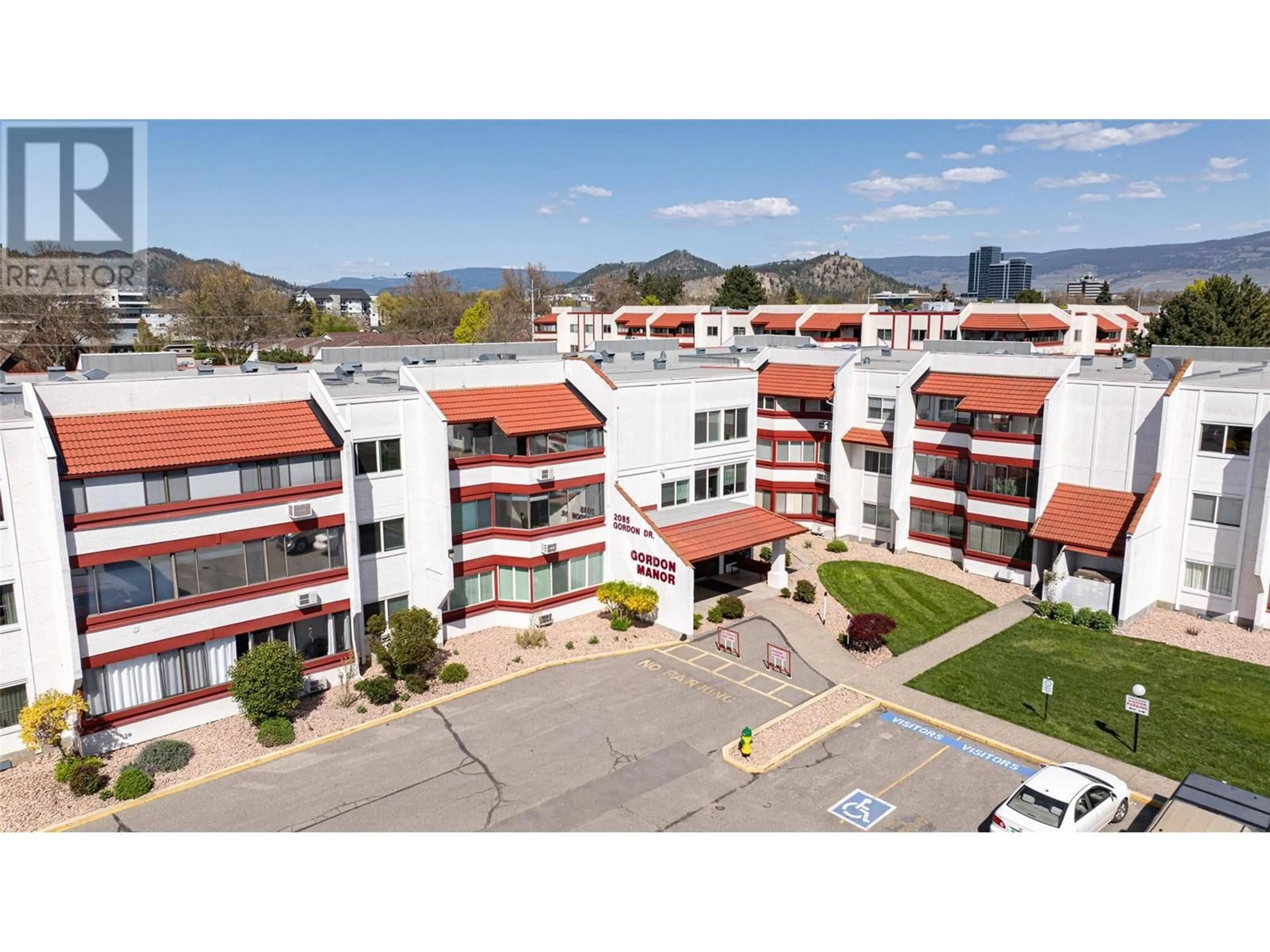 A pic from outside/outdoor area/front of a property/back of a property/a pic from drone, mountain view for 120 - 2085 GORDON DRIVE, Kelowna British Columbia V1Y8S1
