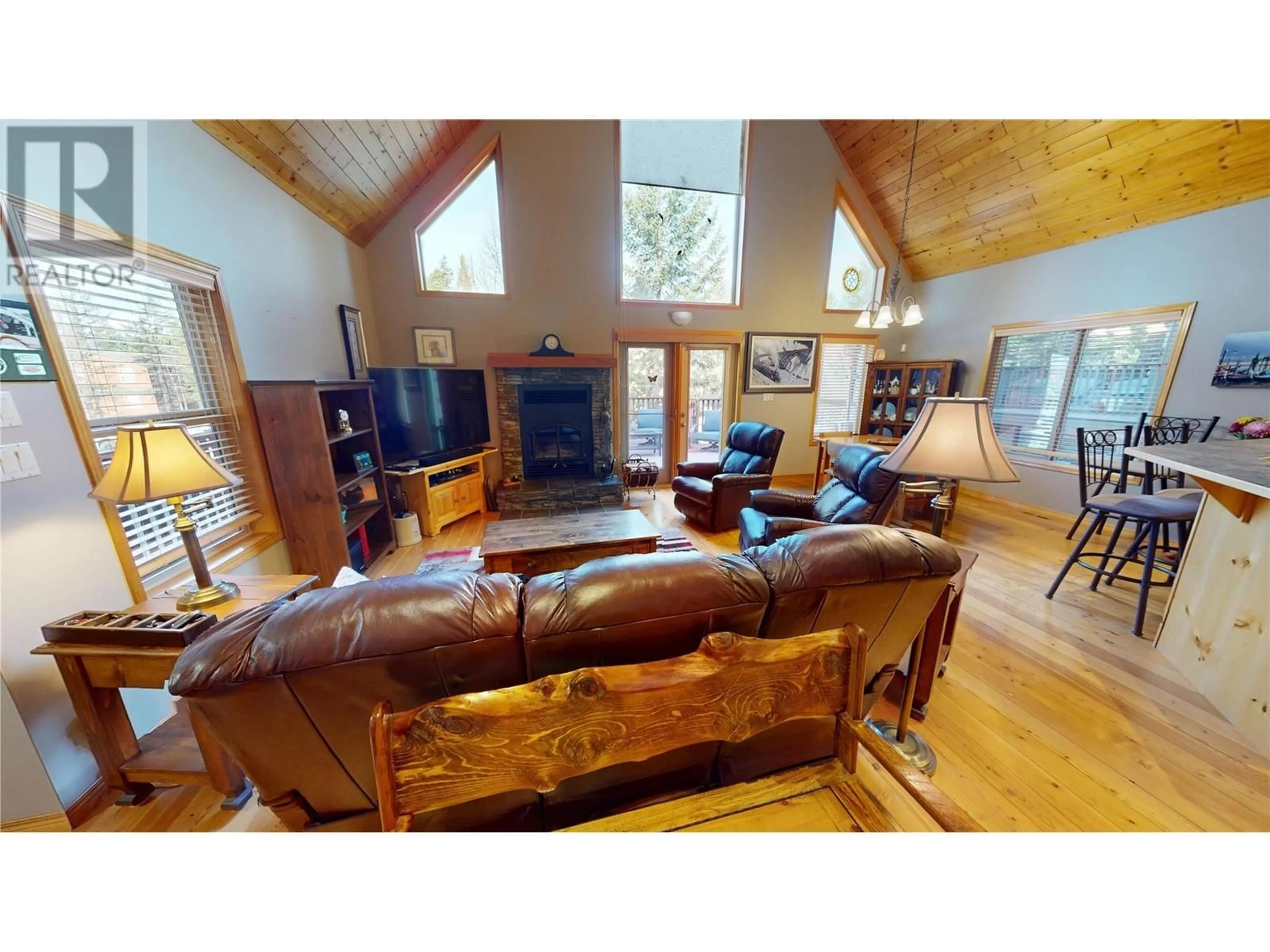 Living room with furniture, wood/laminate floor for 7508 PINE CONE LANE, Radium Hot Springs British Columbia V0A1M0