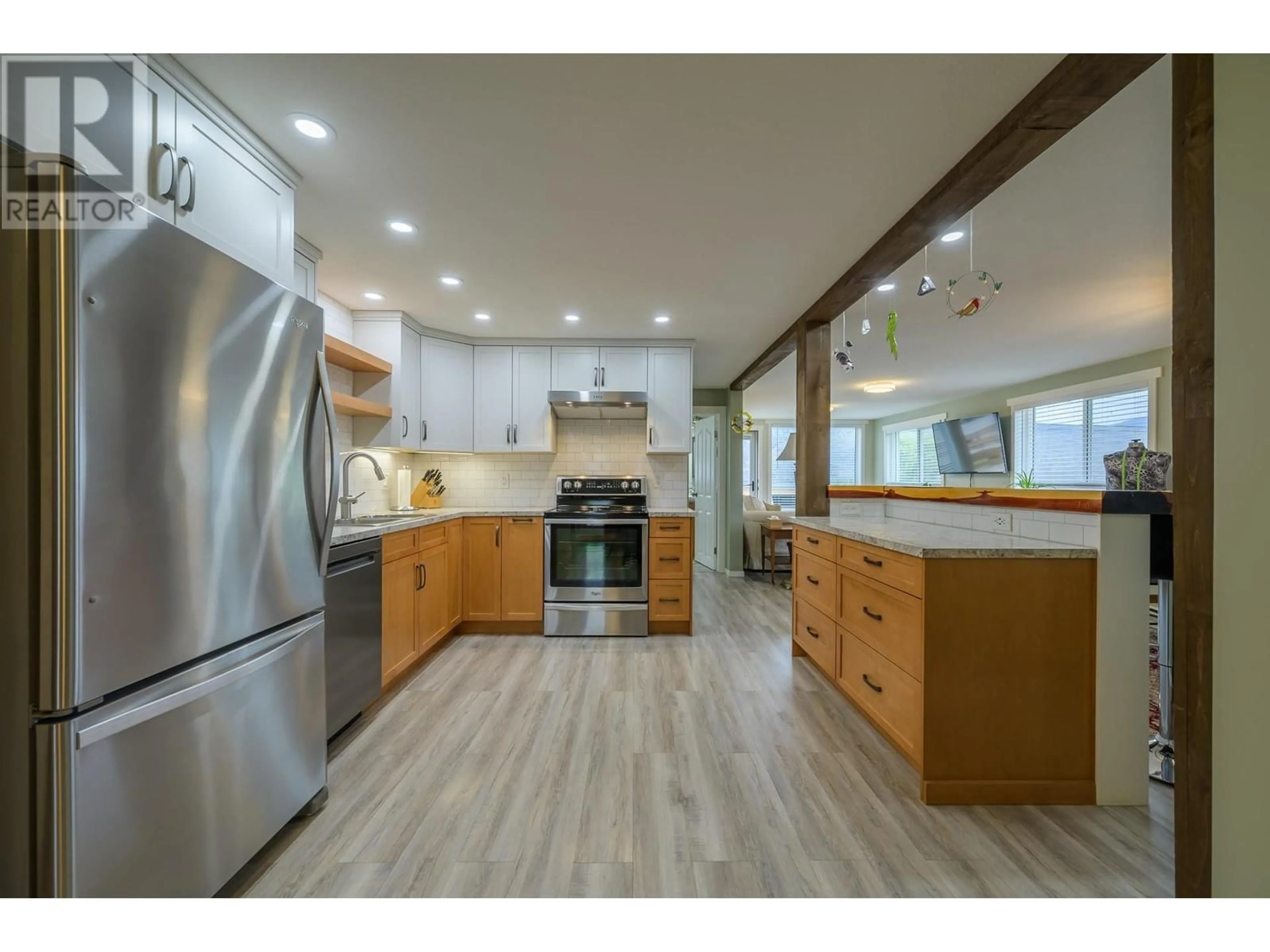 Open concept kitchen, wood/laminate floor for 7040 SAVONA ACCESS RD ROAD, Kamloops British Columbia V0K2J0