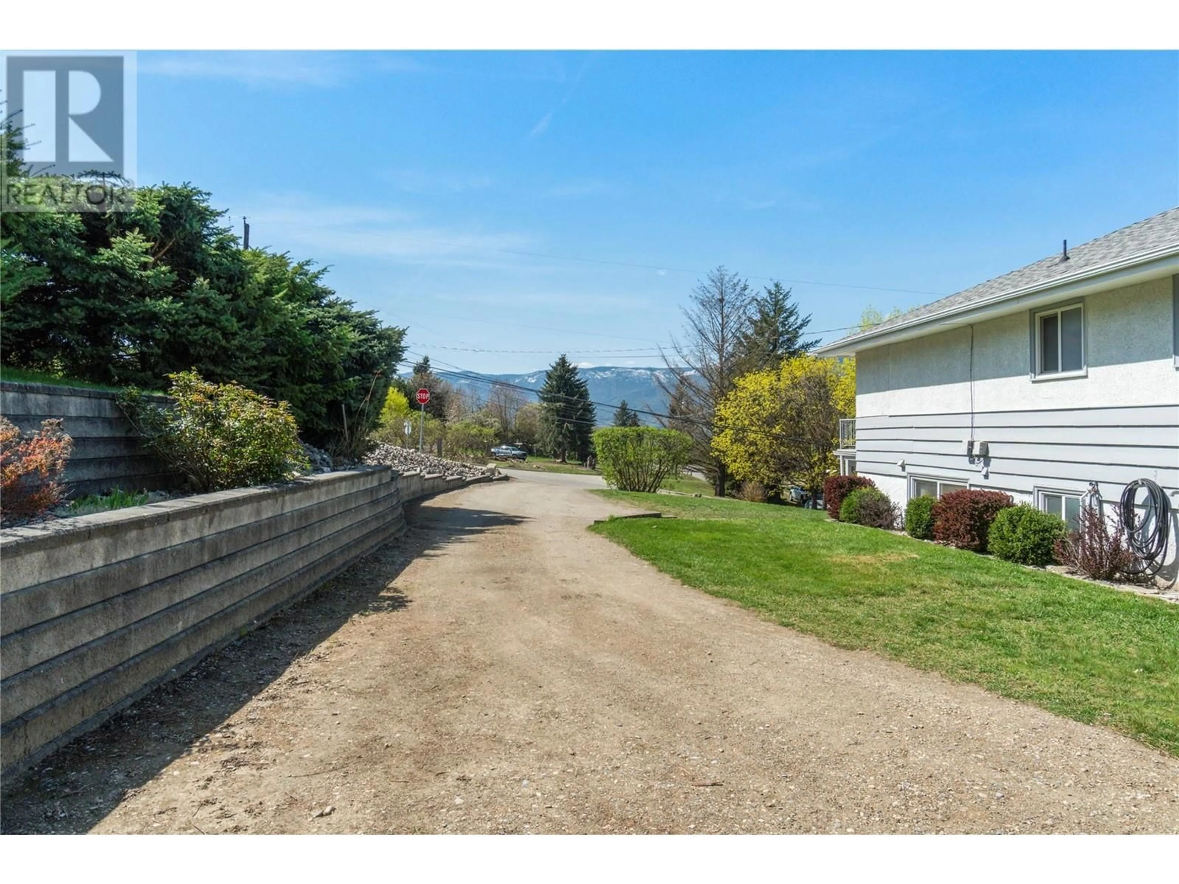 A pic from outside/outdoor area/front of a property/back of a property/a pic from drone, water/lake/river/ocean view for 1290 15 STREET SOUTHEAST, Salmon Arm British Columbia V1E2G8