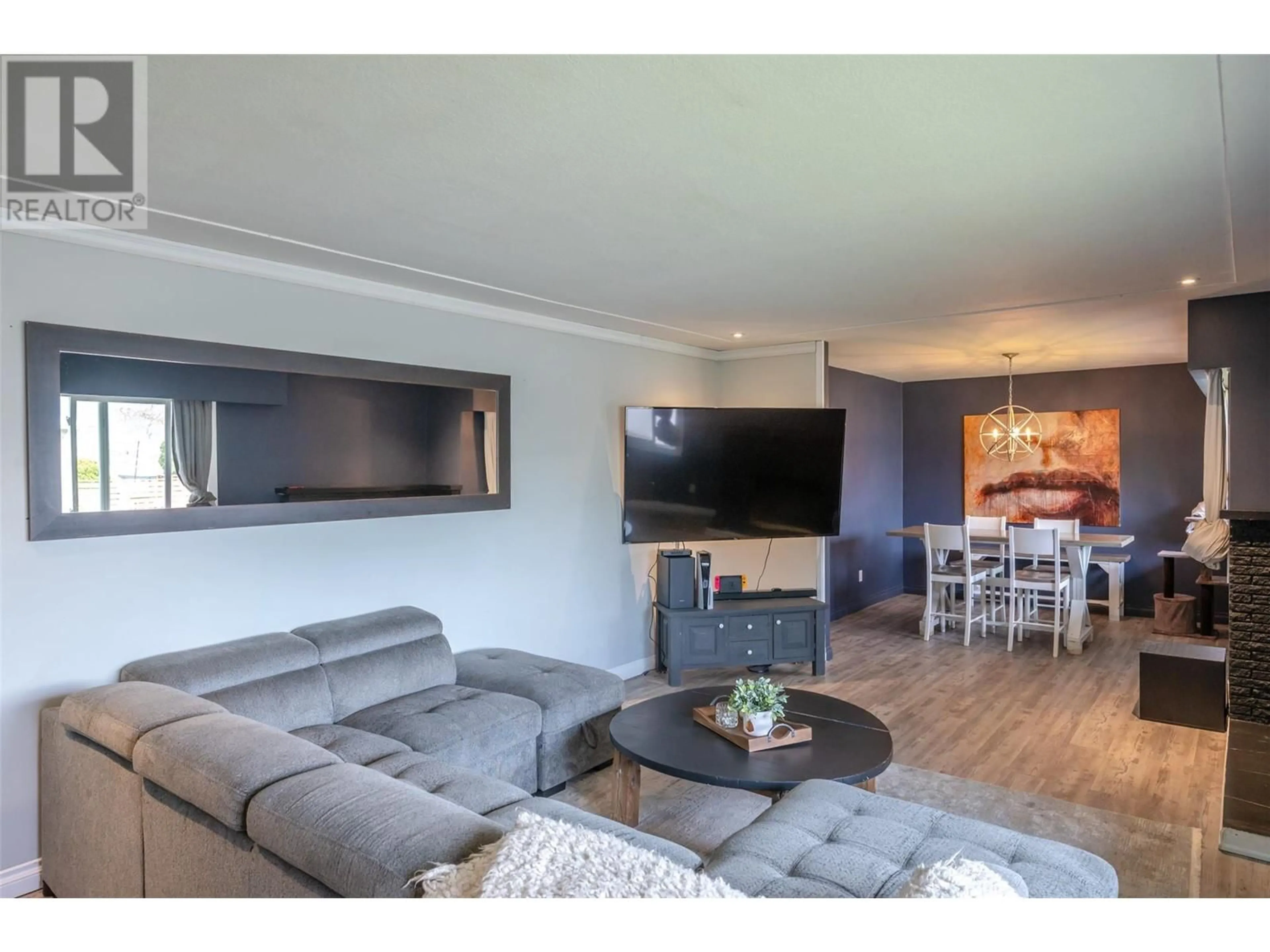Living room with furniture, wood/laminate floor for 402 HEATHER ROAD, Penticton British Columbia V2a6P2