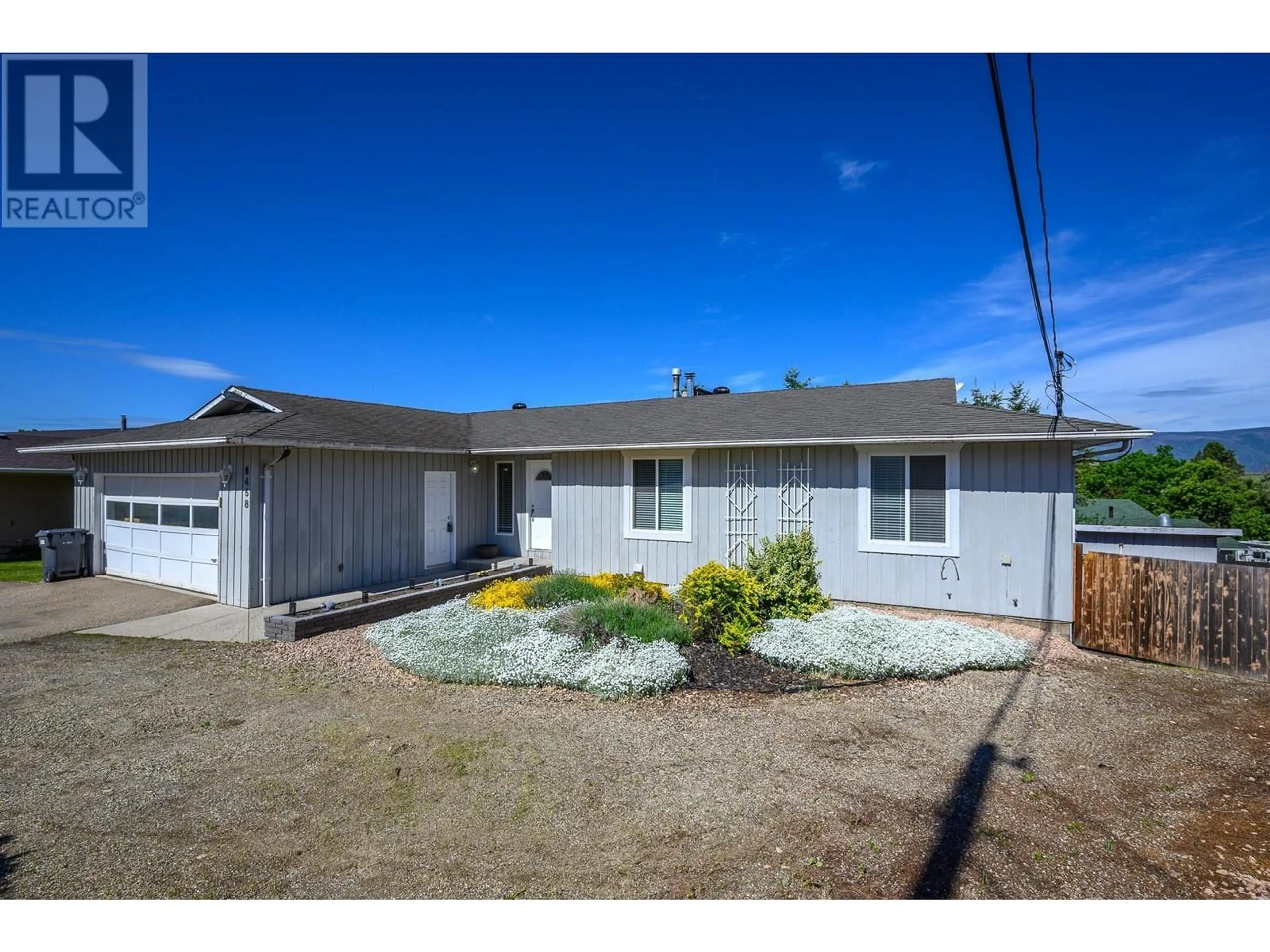 A pic from outside/outdoor area/front of a property/back of a property/a pic from drone, street for 6458 CARLTON ROAD, Vernon British Columbia V1B3T5