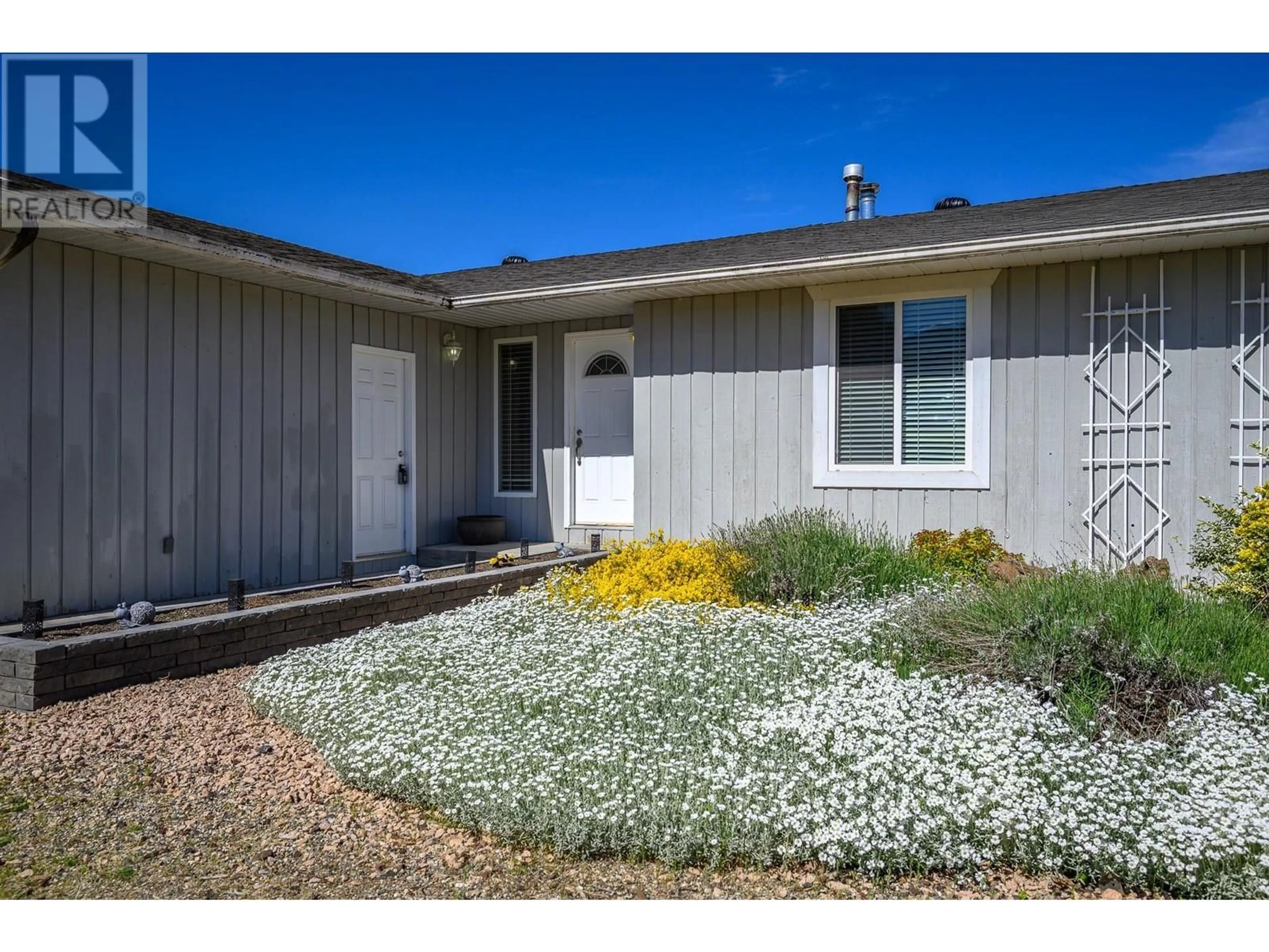 Home with vinyl exterior material, street for 6458 CARLTON ROAD, Vernon British Columbia V1B3T5