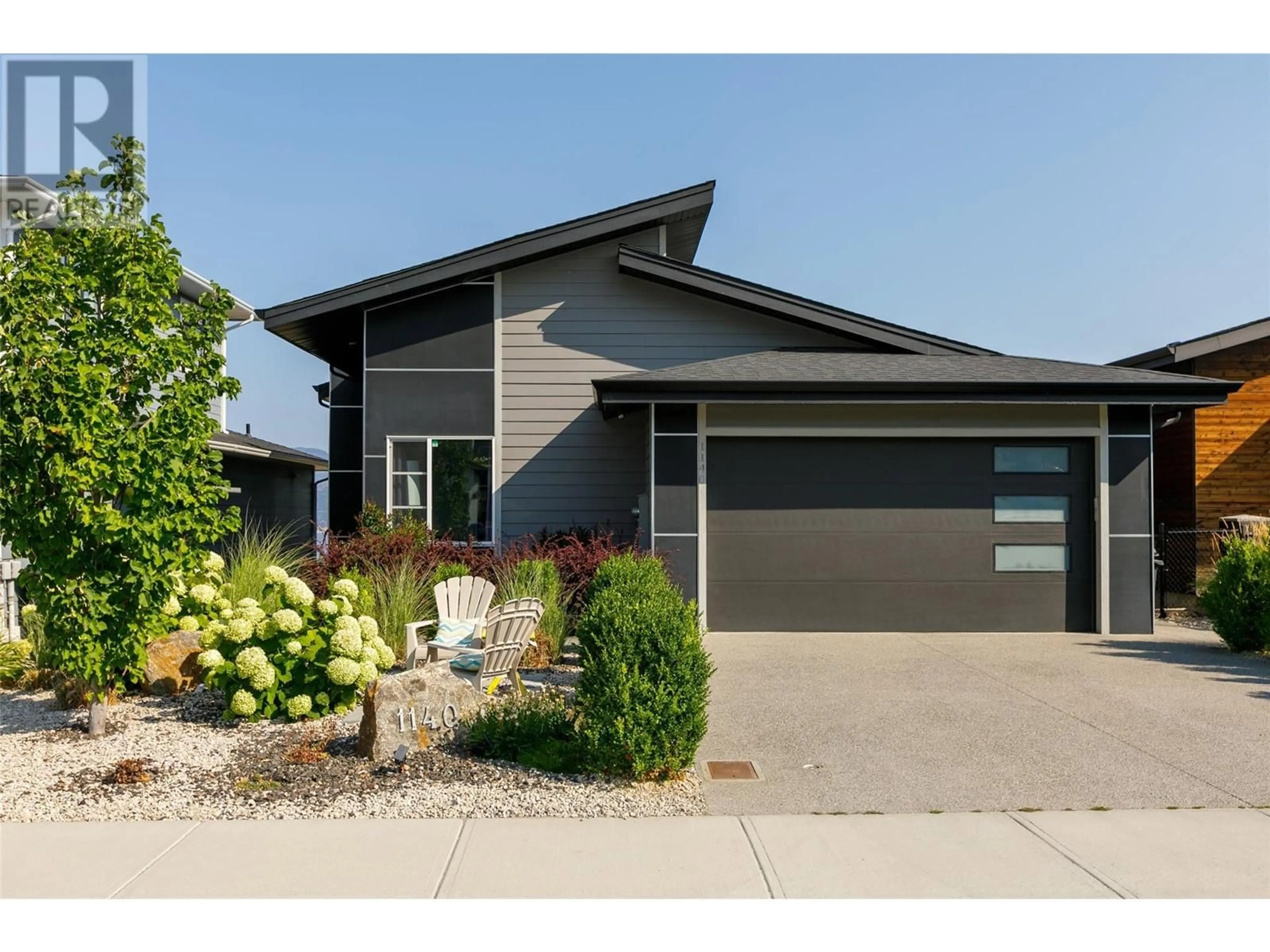 Home with vinyl exterior material, street for 1140 GOLDFINCH PLACE, Kelowna British Columbia V1W5M1