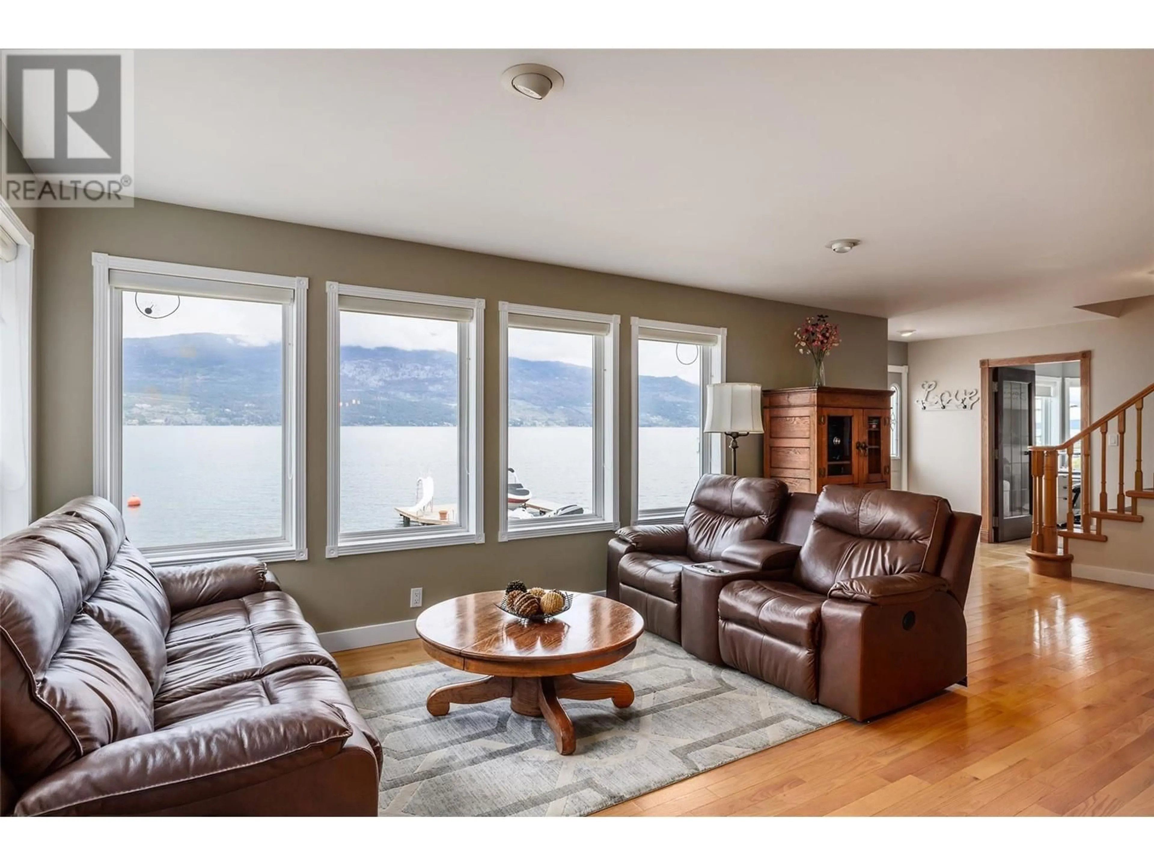 Living room with furniture, wood/laminate floor for 17824 JUNIPER COVE ROAD, Lake Country British Columbia V4V1B8