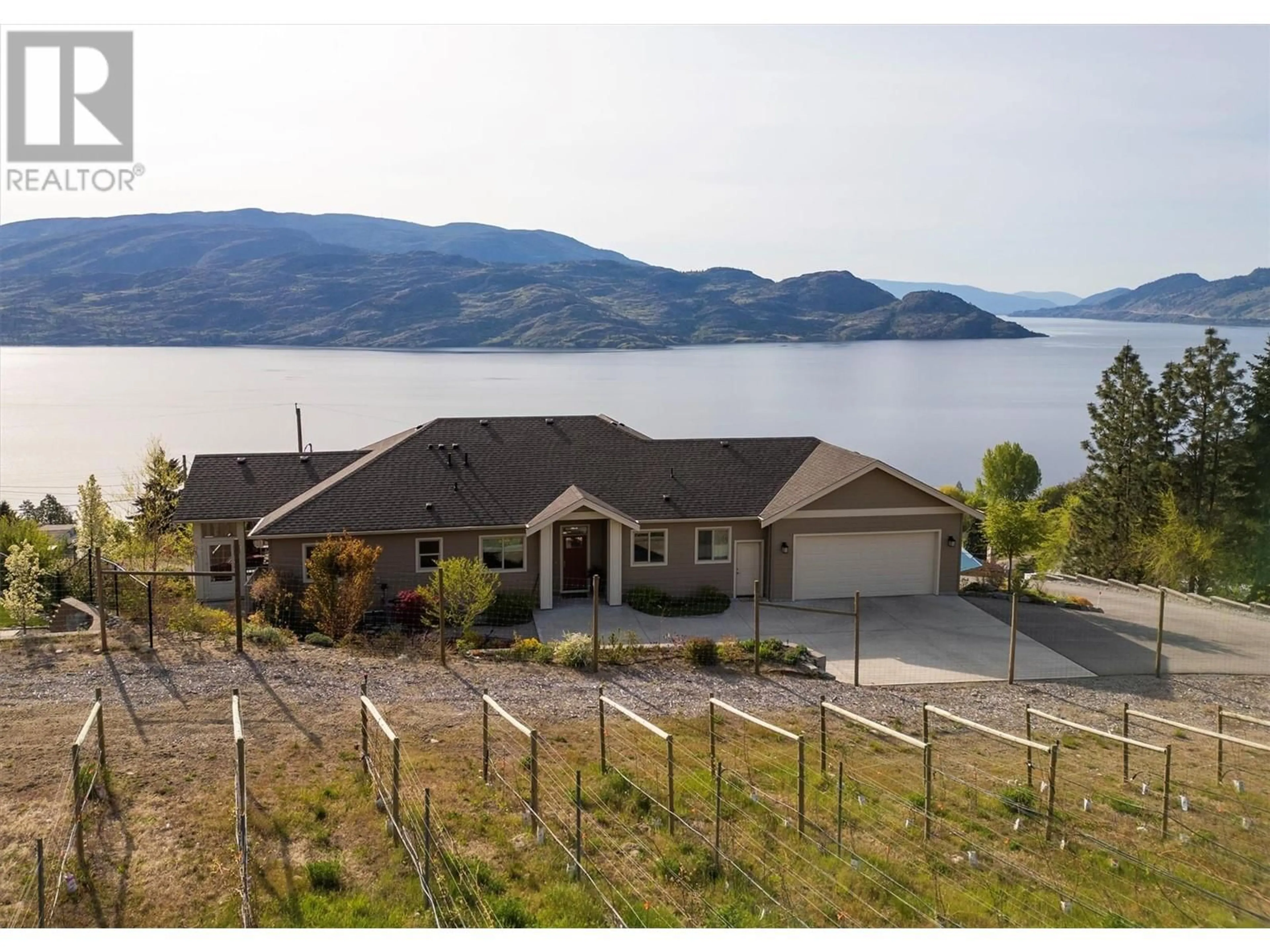 A pic from outside/outdoor area/front of a property/back of a property/a pic from drone, water/lake/river/ocean view for 5884 MACGREGOR ROAD, Peachland British Columbia V0H1X4