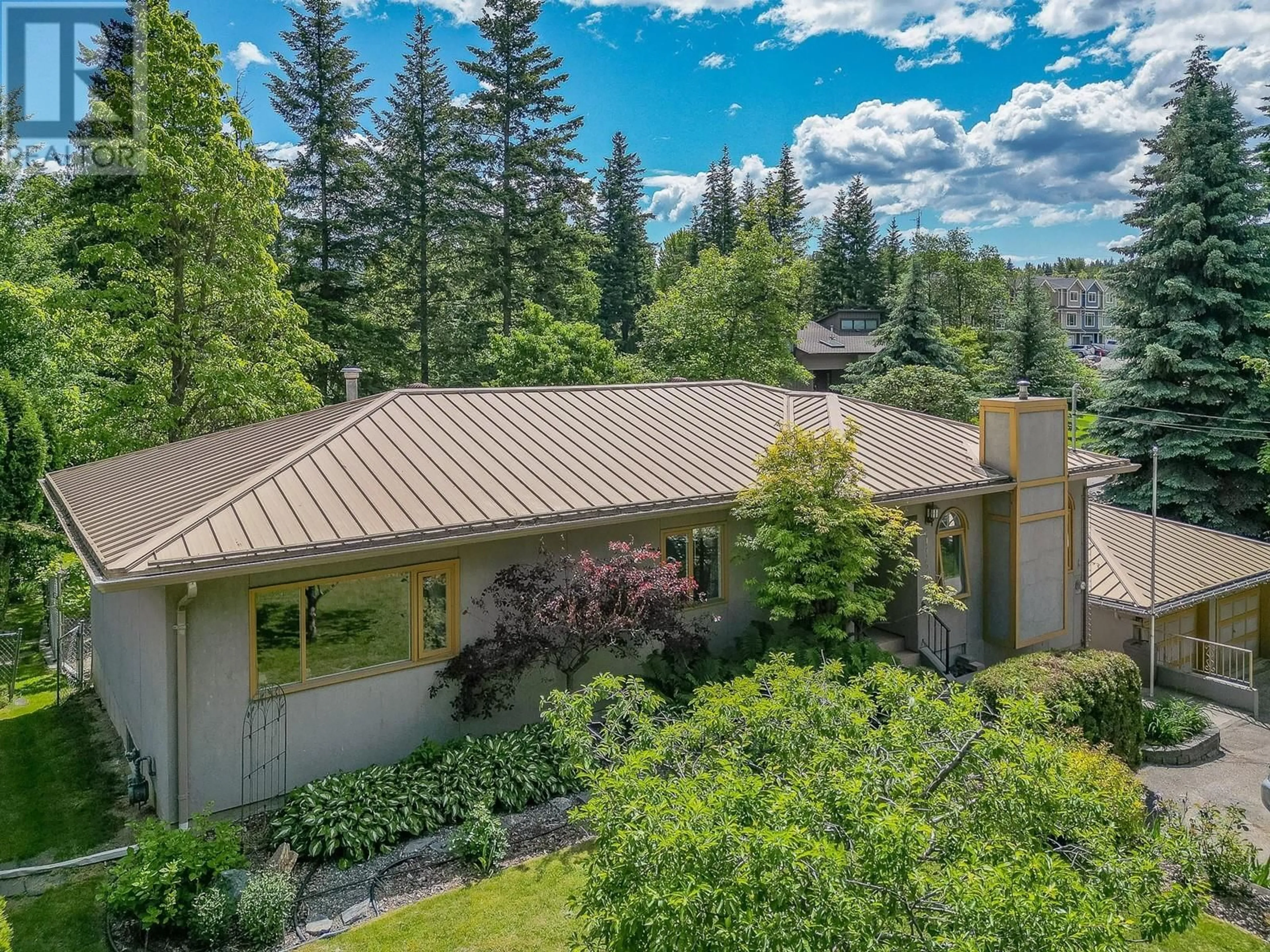 A pic from outside/outdoor area/front of a property/back of a property/a pic from drone, forest/trees view for 1180 18 STREET NORTHEAST, Salmon Arm British Columbia V1E2T4