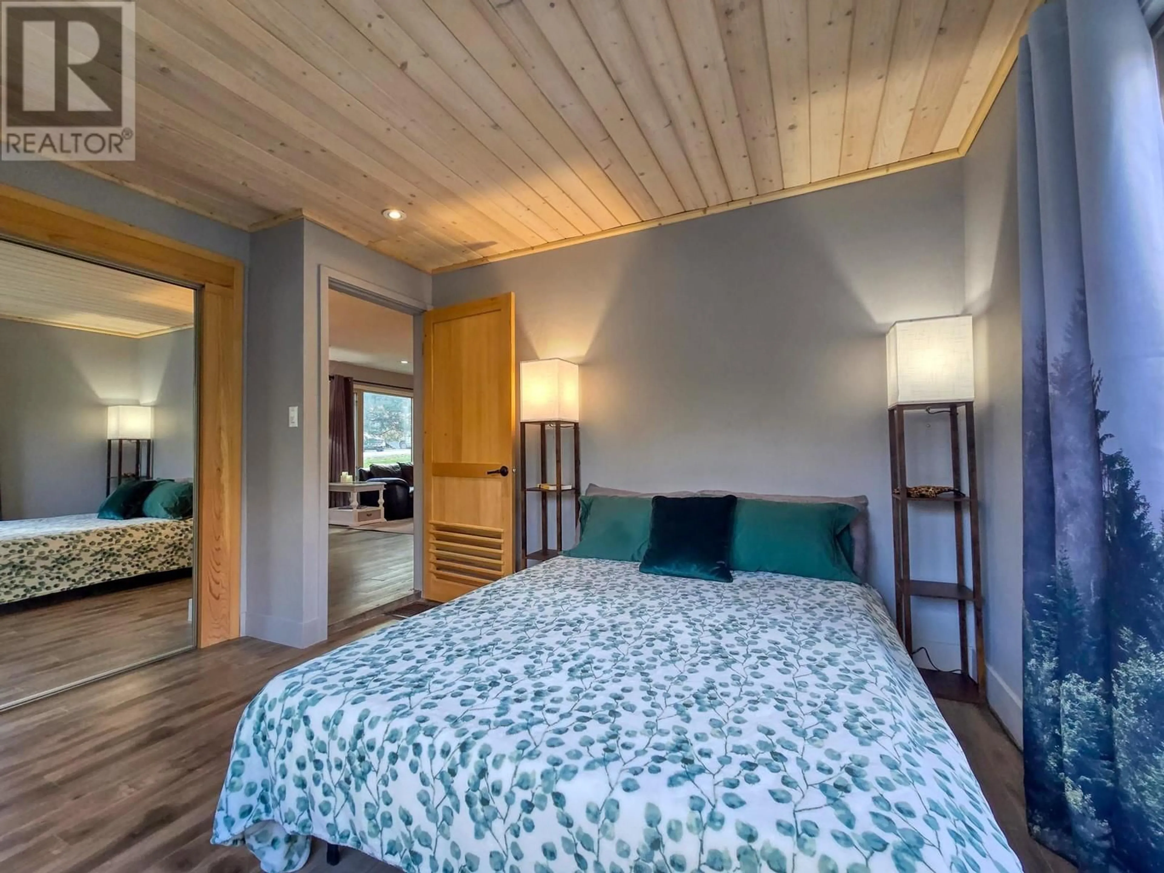 Bedroom with bed, wood/laminate floor for 5765 COLUMBIA ROAD, Edgewater British Columbia V0A1E0