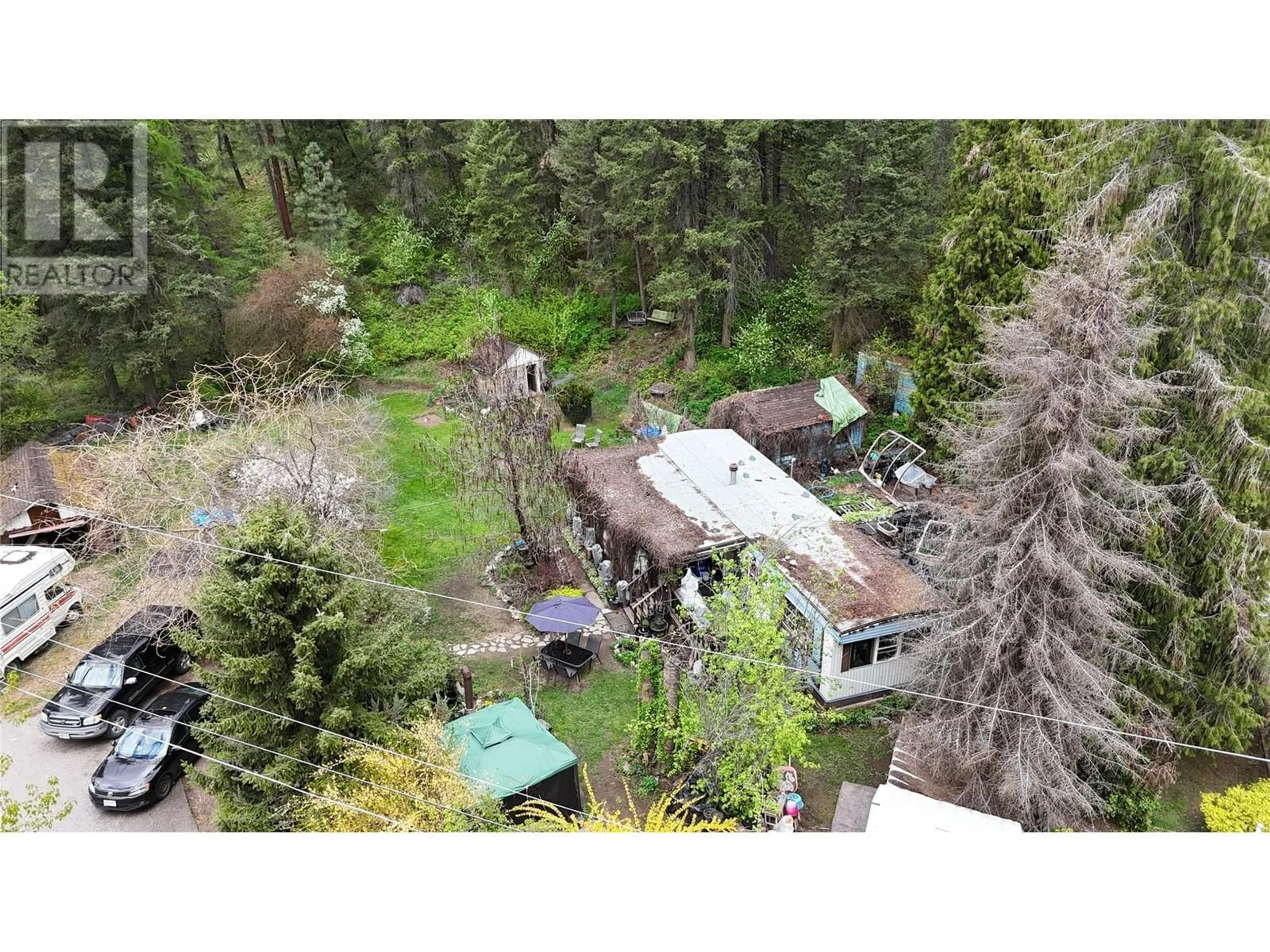 A pic from outside/outdoor area/front of a property/back of a property/a pic from drone, forest/trees view for 1680 CHANDLER ROAD, Christina Lake British Columbia V0H1E0