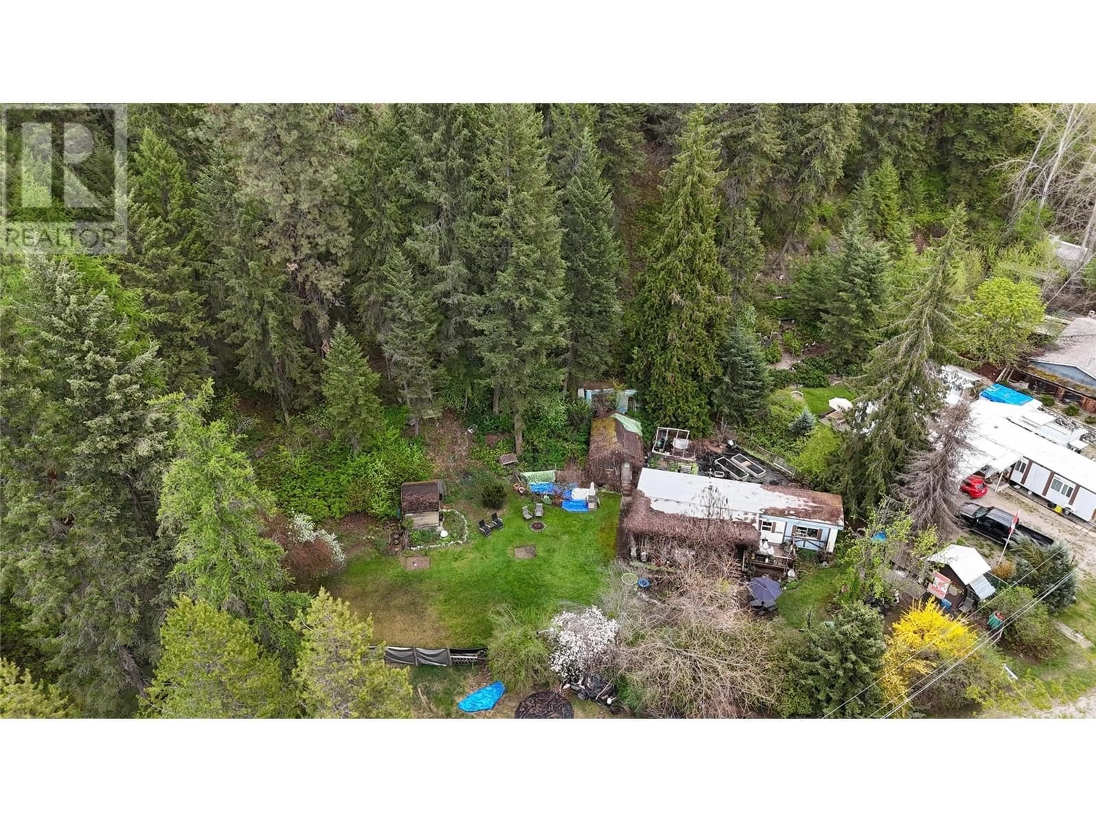 A pic from outside/outdoor area/front of a property/back of a property/a pic from drone, forest/trees view for 1680 CHANDLER ROAD, Christina Lake British Columbia V0H1E0