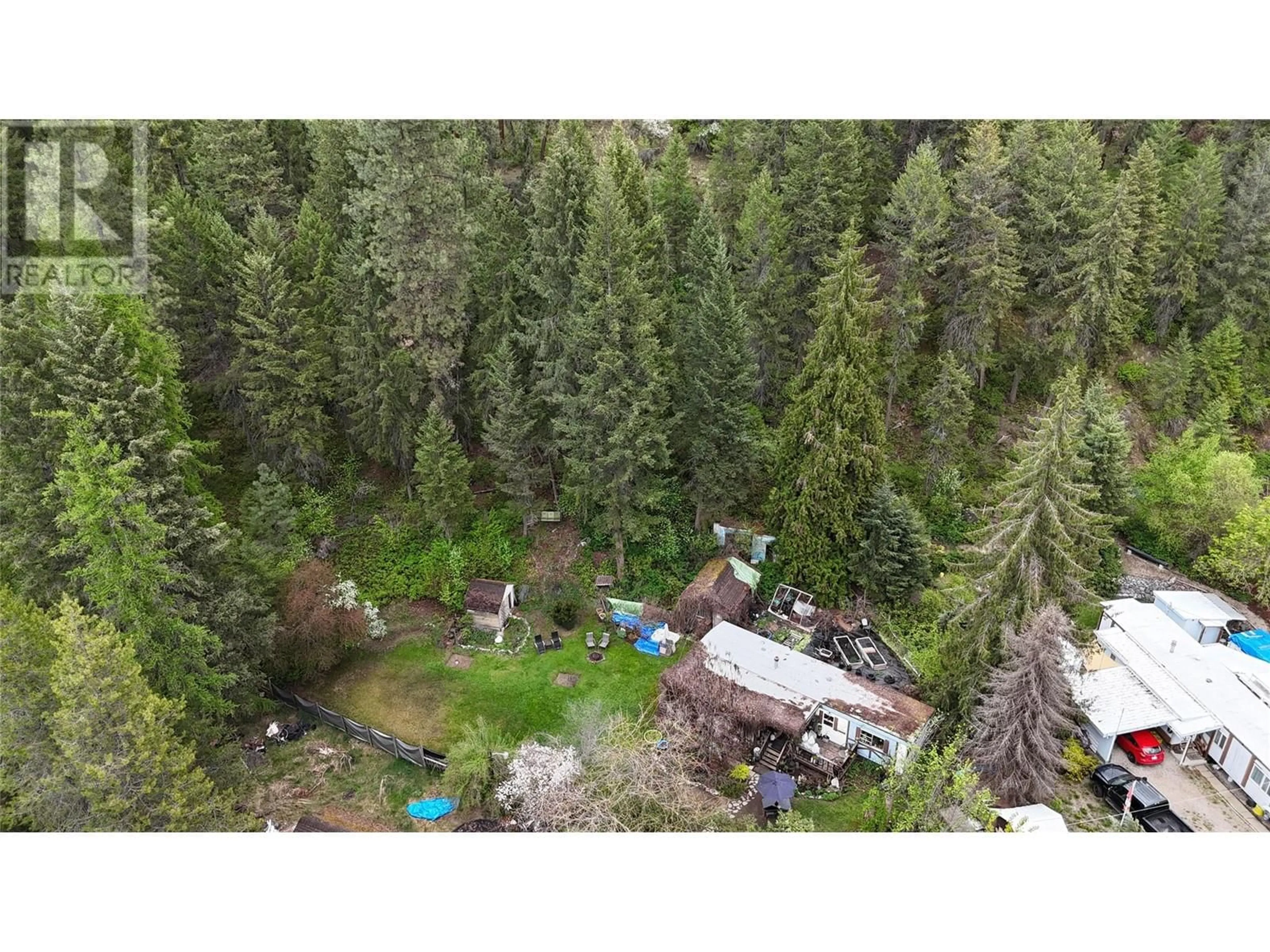 A pic from outside/outdoor area/front of a property/back of a property/a pic from drone, forest/trees view for 1680 CHANDLER ROAD, Christina Lake British Columbia V0H1E0