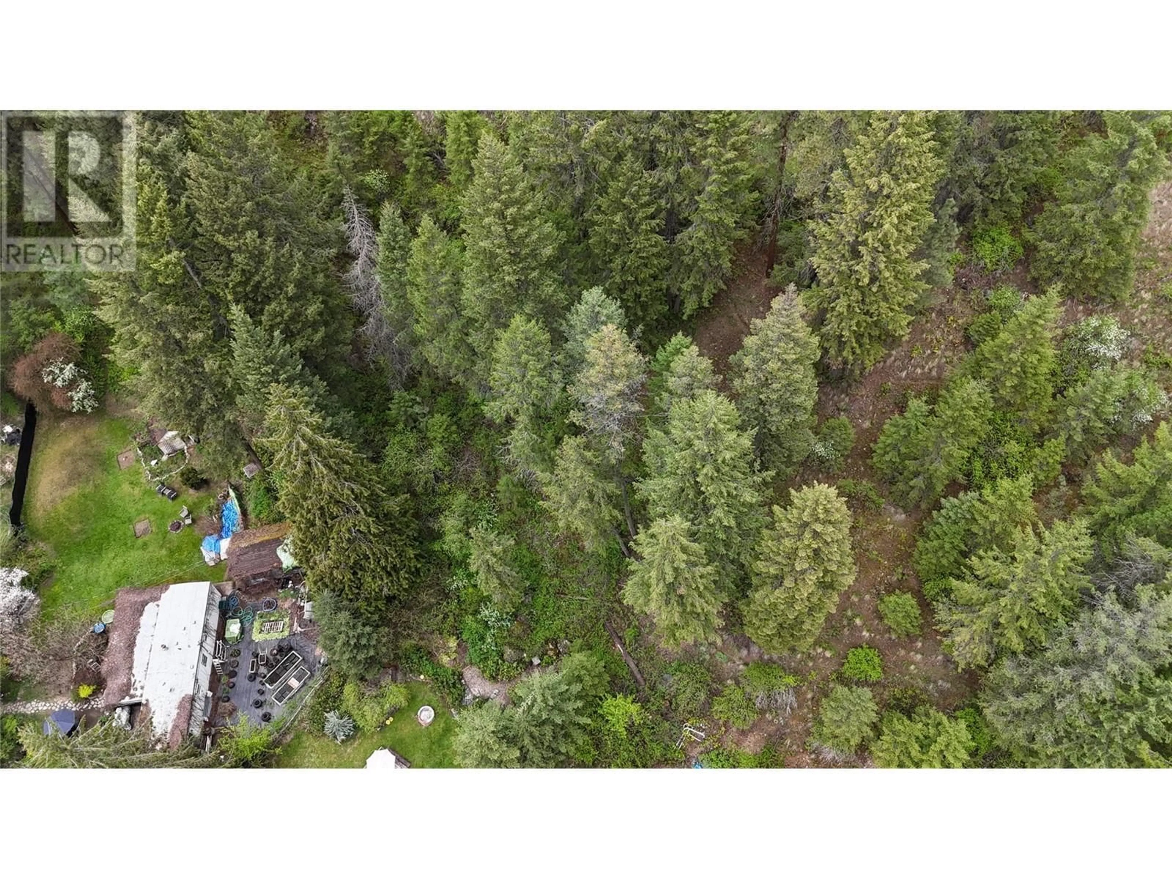 A pic from outside/outdoor area/front of a property/back of a property/a pic from drone, forest/trees view for 1680 CHANDLER ROAD, Christina Lake British Columbia V0H1E0