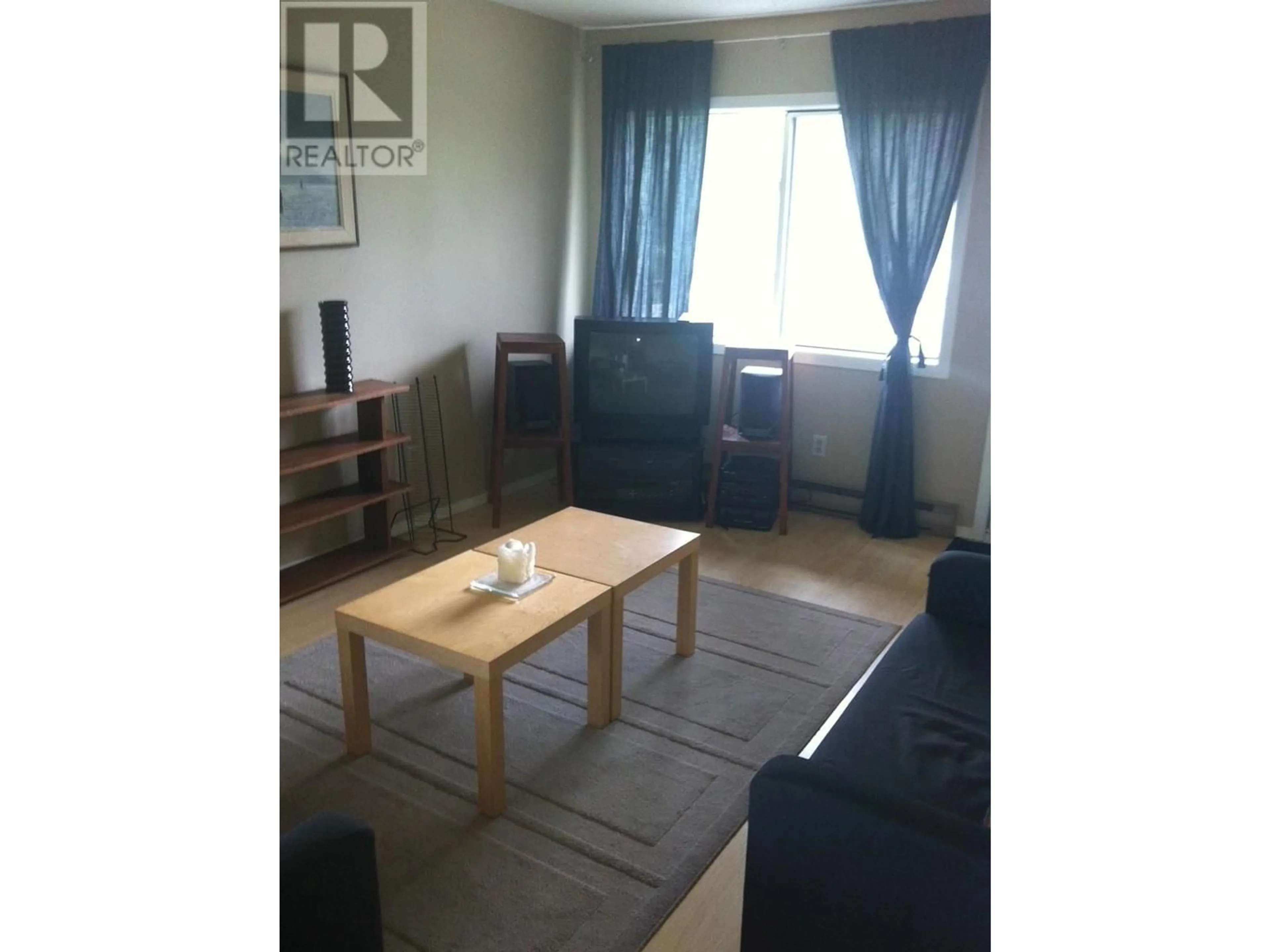 Living room with furniture, wood/laminate floor for 401 - 10 CARIBOO DRIVE, Elkford British Columbia V0B1H0