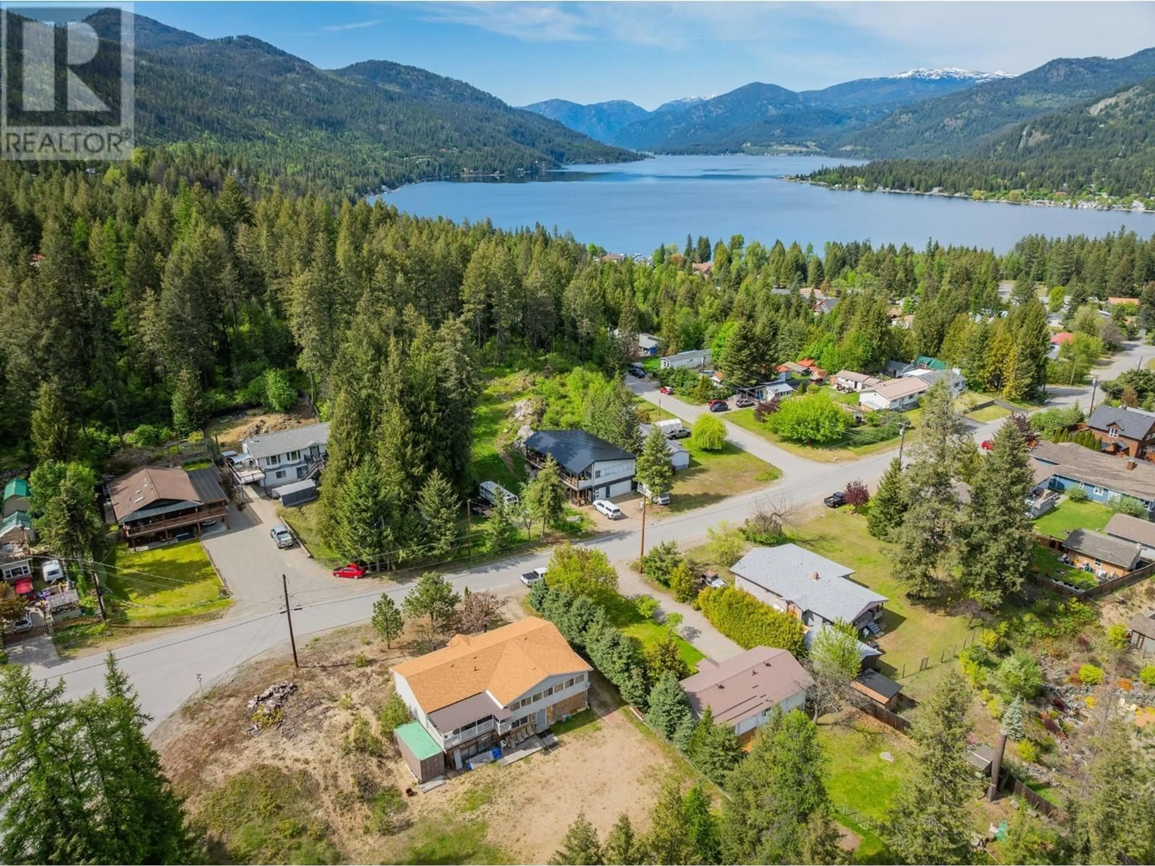 A pic from outside/outdoor area/front of a property/back of a property/a pic from drone, water/lake/river/ocean view for 60 CHASE ROAD, Christina Lake British Columbia V0G1E0