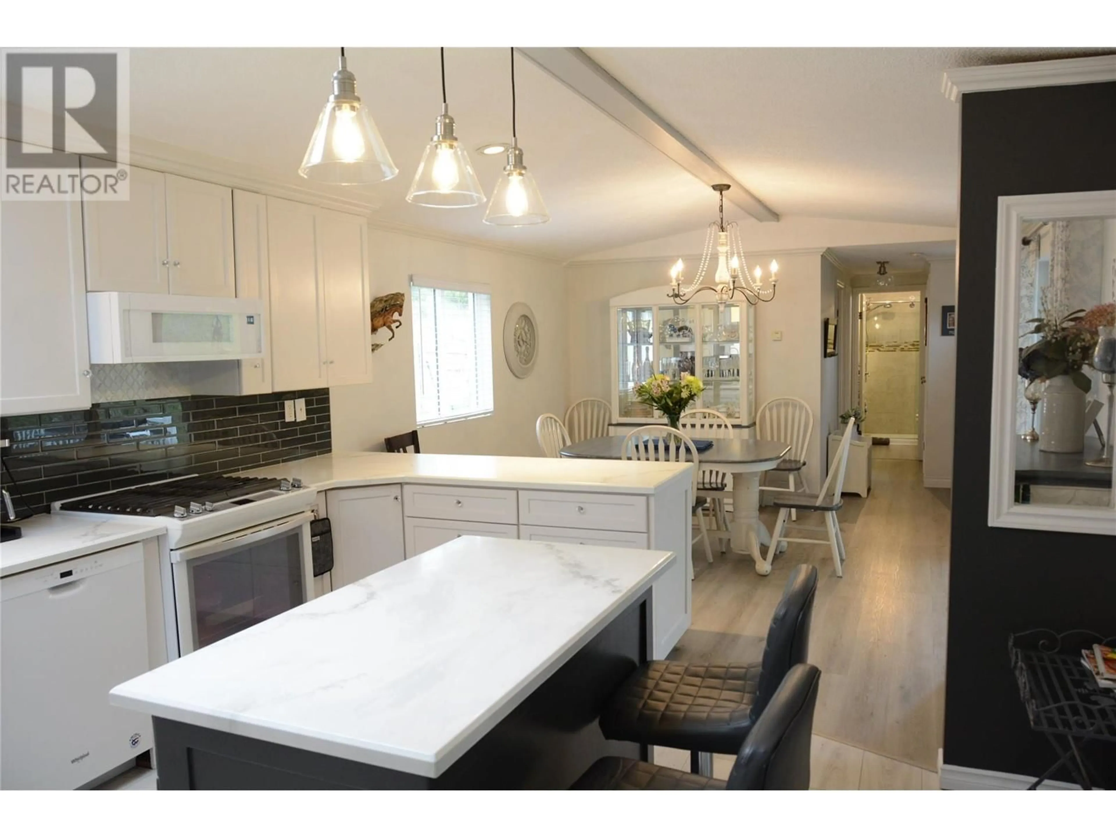 Open concept kitchen, wood/laminate floor for 185 HOOVERS FERRY ROAD, Kamloops British Columbia V0E1Z0
