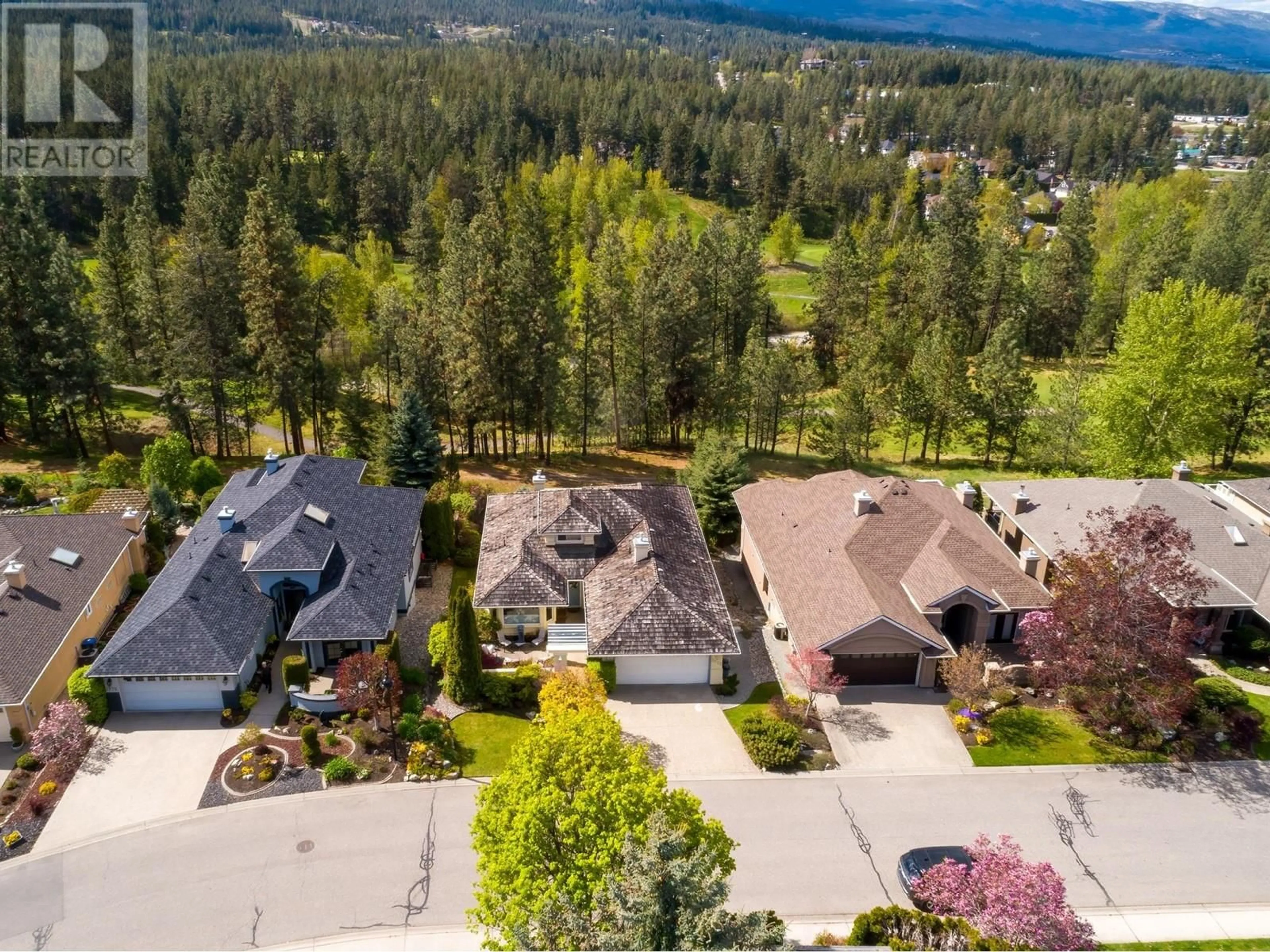 A pic from outside/outdoor area/front of a property/back of a property/a pic from drone, mountain view for 3973 GALLAGHERS CIRCLE, Kelowna British Columbia V1W3Z9