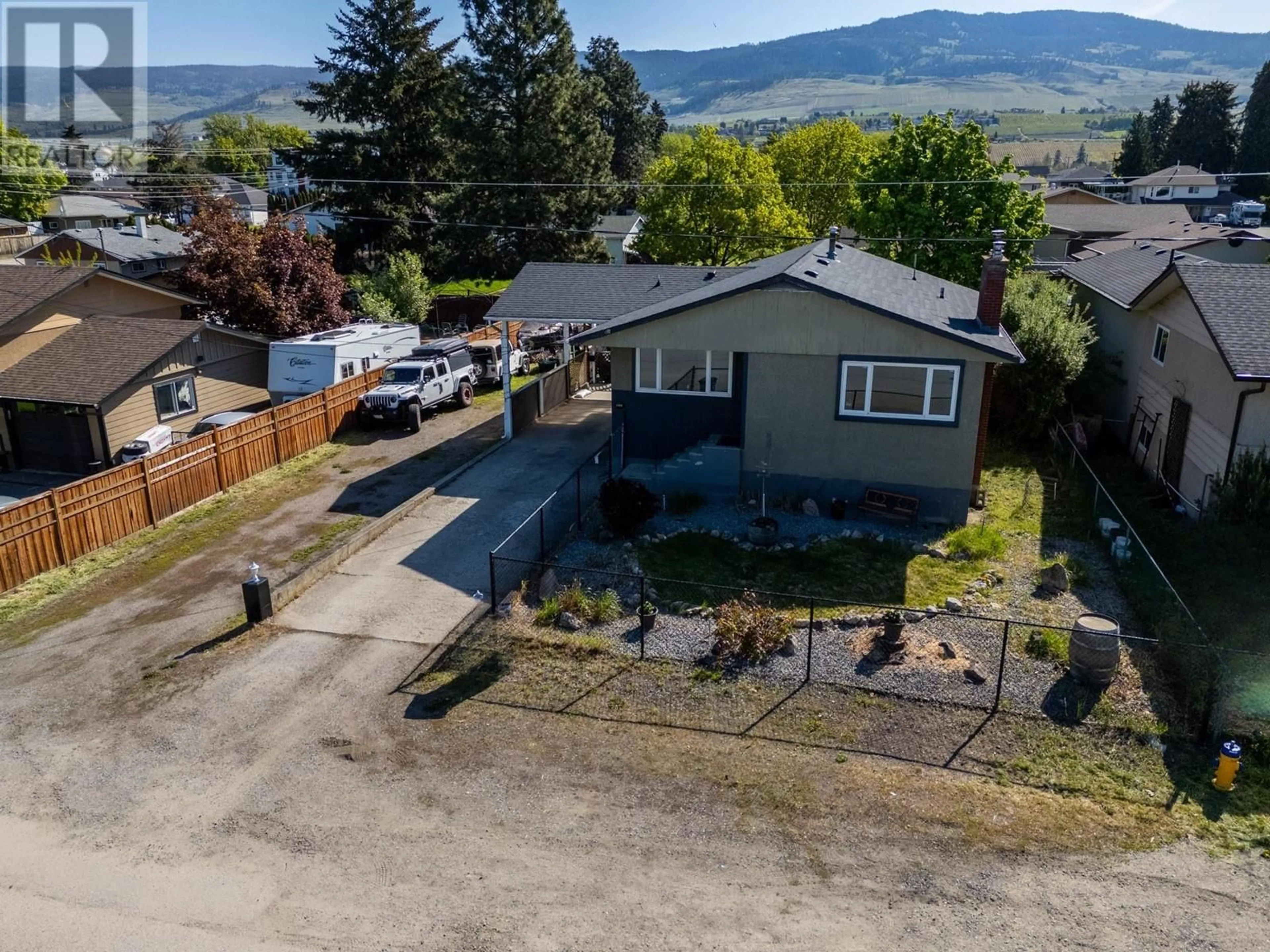 A pic from outside/outdoor area/front of a property/back of a property/a pic from drone, mountain view for 935 KNORR ROAD, Kelowna British Columbia V1X3G9
