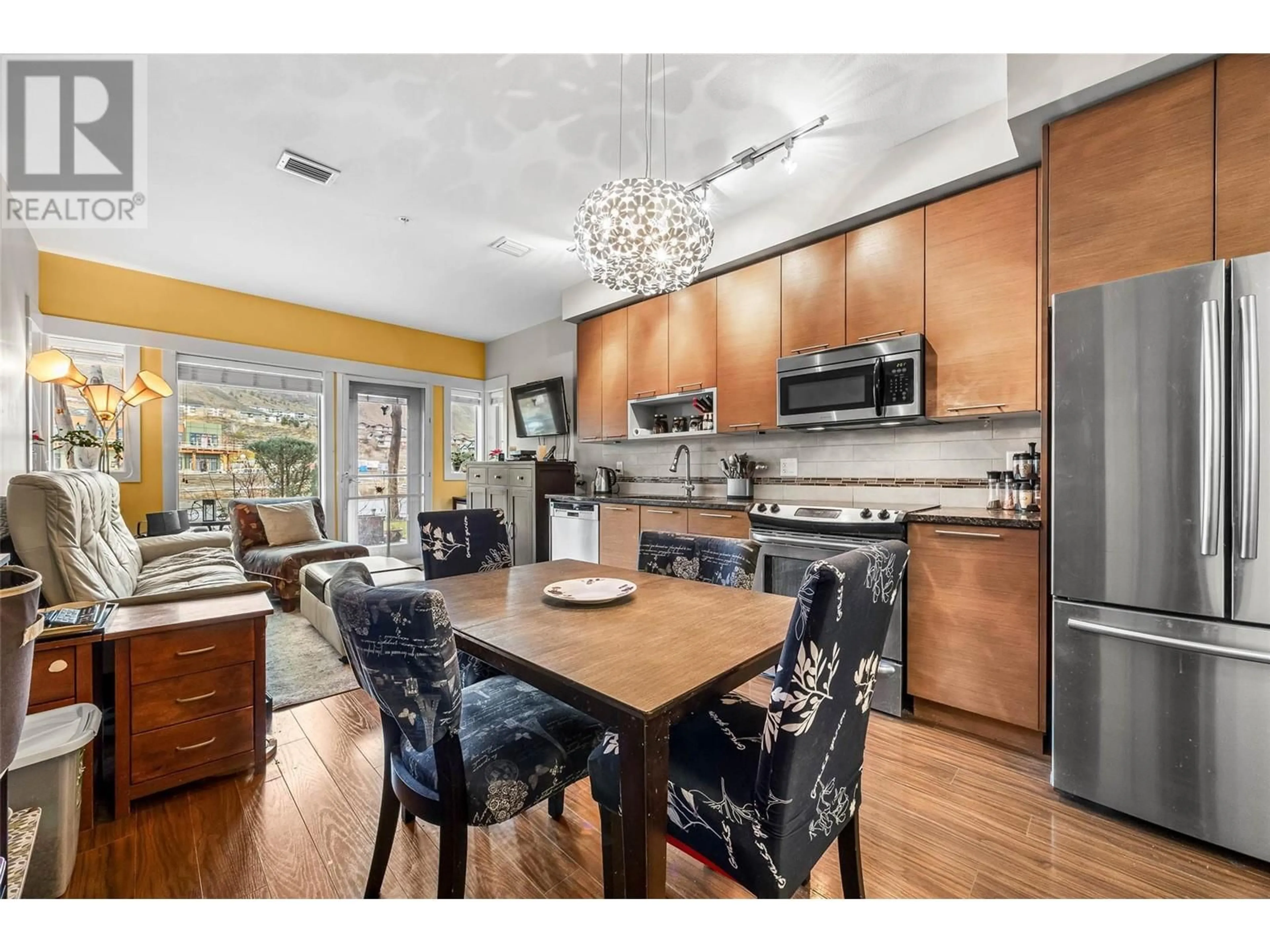 Open concept kitchen, wood/laminate floor for 2106 - 1030 TALASA WAY, Kamloops British Columbia V2H0C3