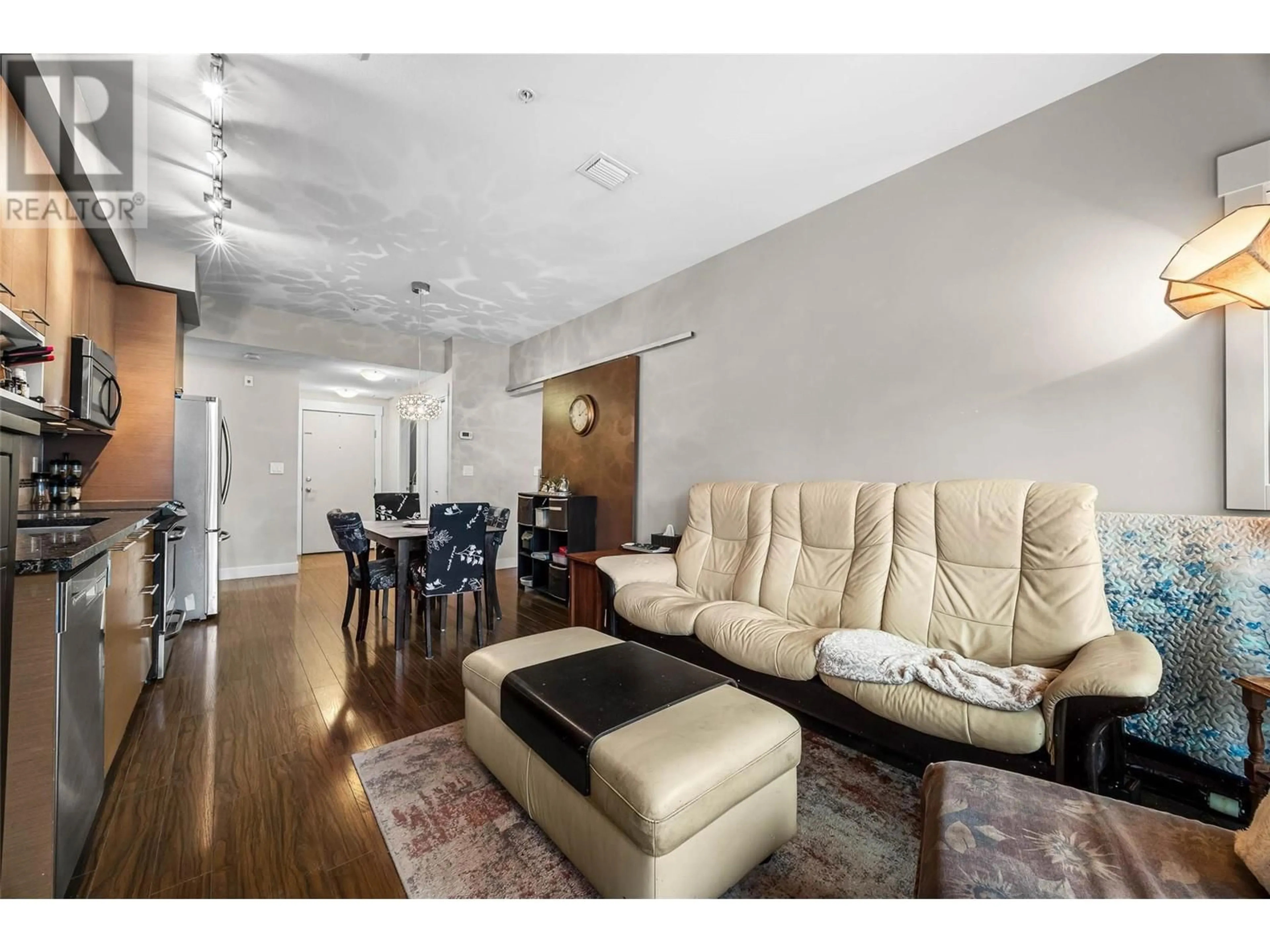 Living room with furniture, wood/laminate floor for 2106 - 1030 TALASA WAY, Kamloops British Columbia V2H0C3