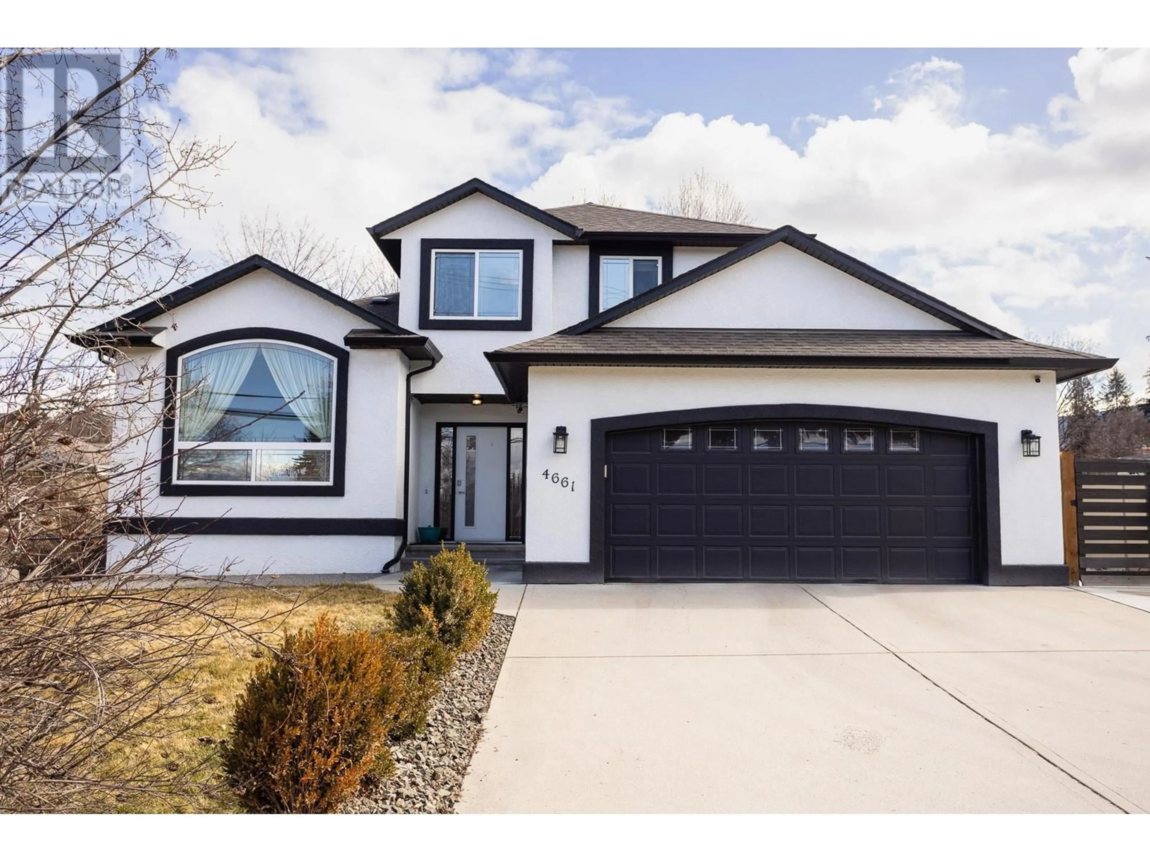 Home with vinyl exterior material, street for 4661 GORDON DRIVE, Kelowna British Columbia V1W1T5