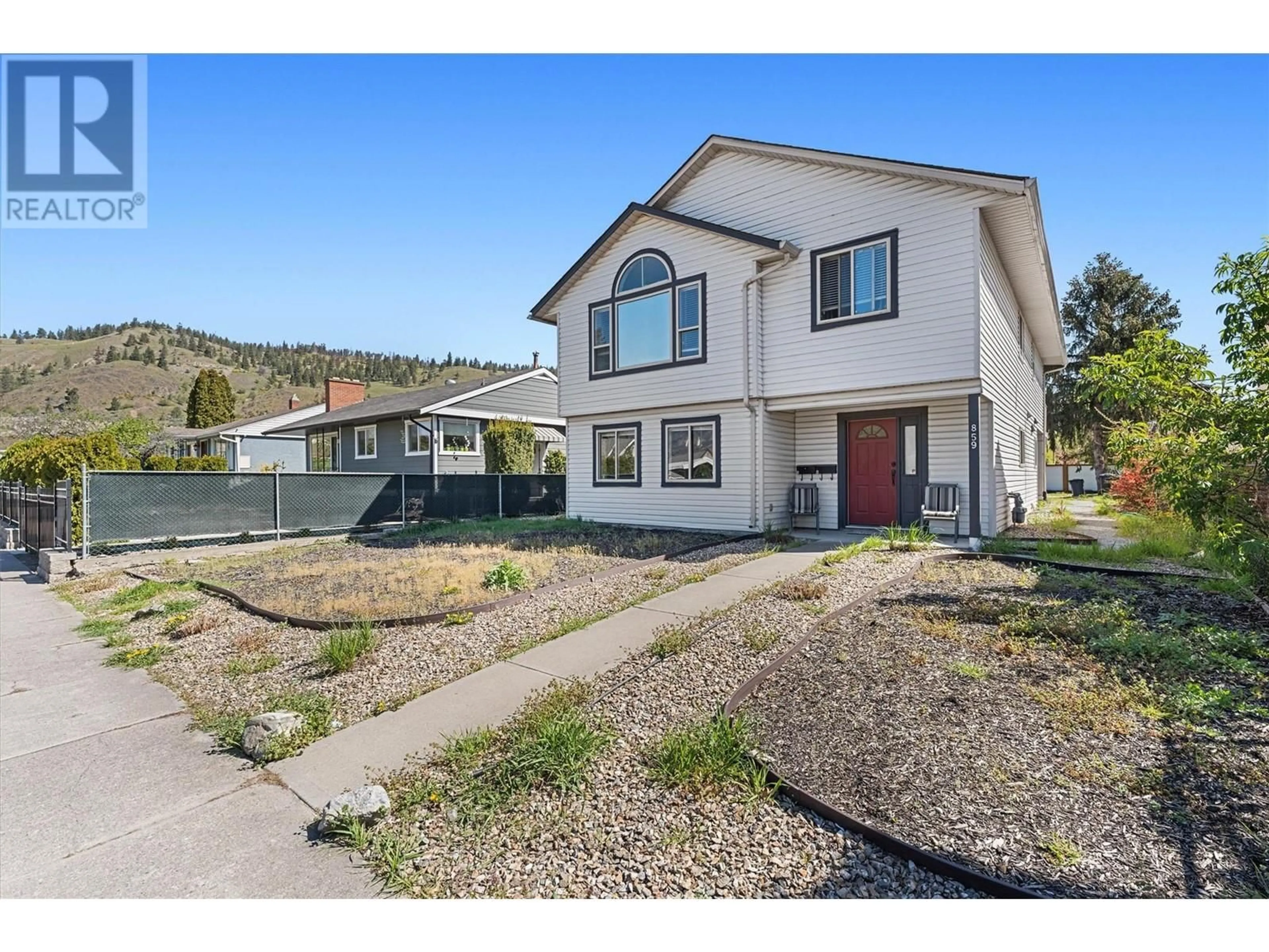 Home with vinyl exterior material, street for 859 RICHTER STREET, Kelowna British Columbia V1Y2J9