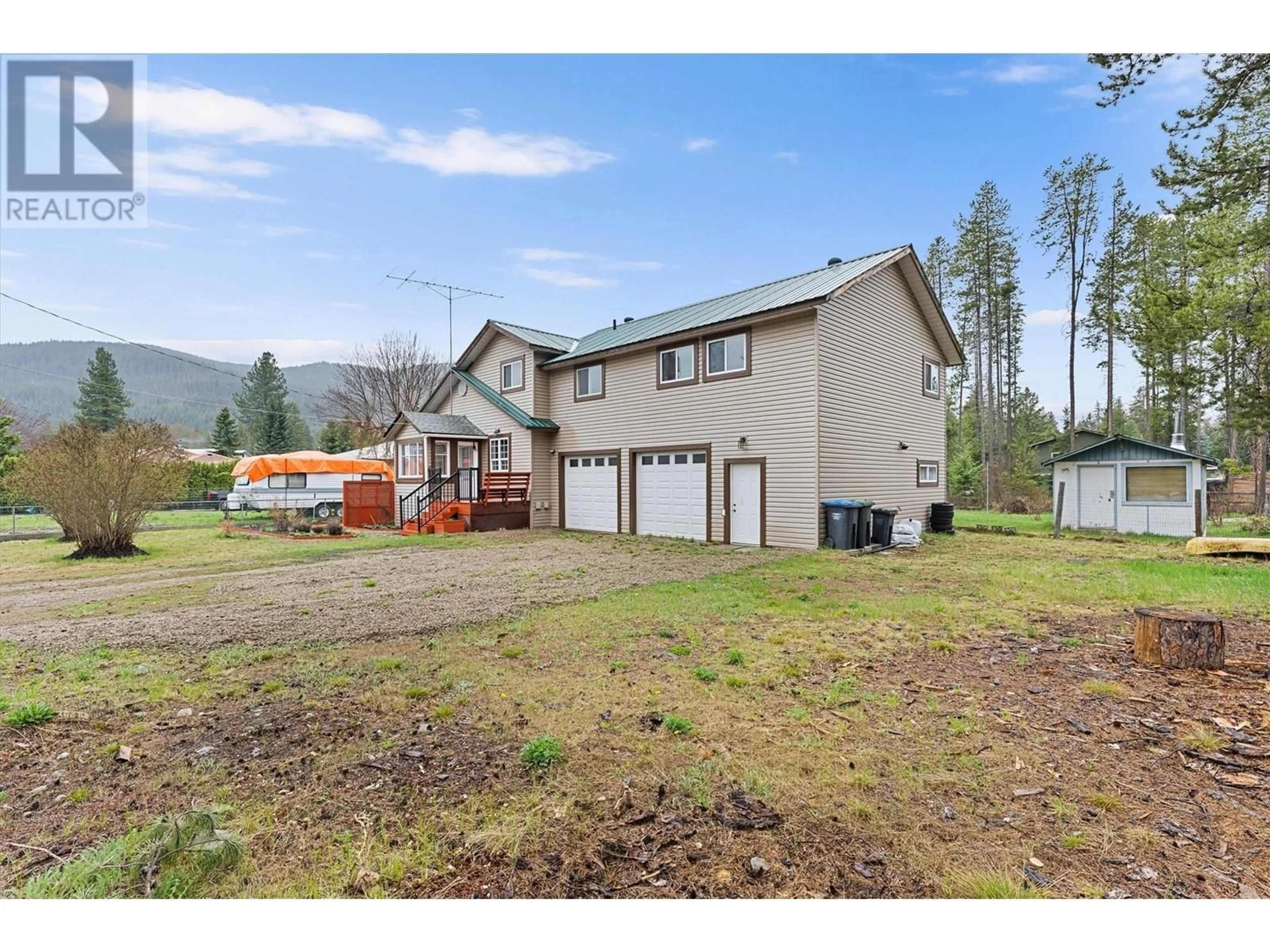 A pic from outside/outdoor area/front of a property/back of a property/a pic from drone, mountain view for 2190 DION ROAD, Kelowna British Columbia V1X1K2