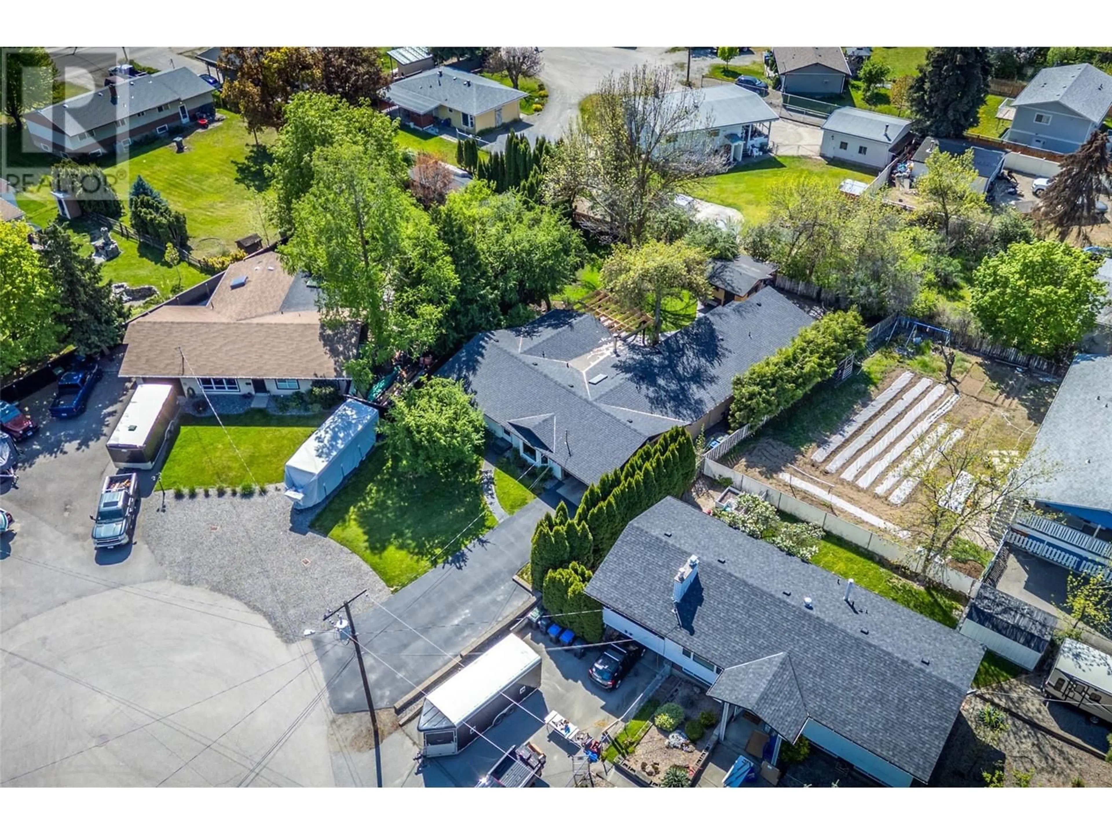 A pic from outside/outdoor area/front of a property/back of a property/a pic from drone, street for 430 PINE ROAD, Kelowna British Columbia V1X4L8