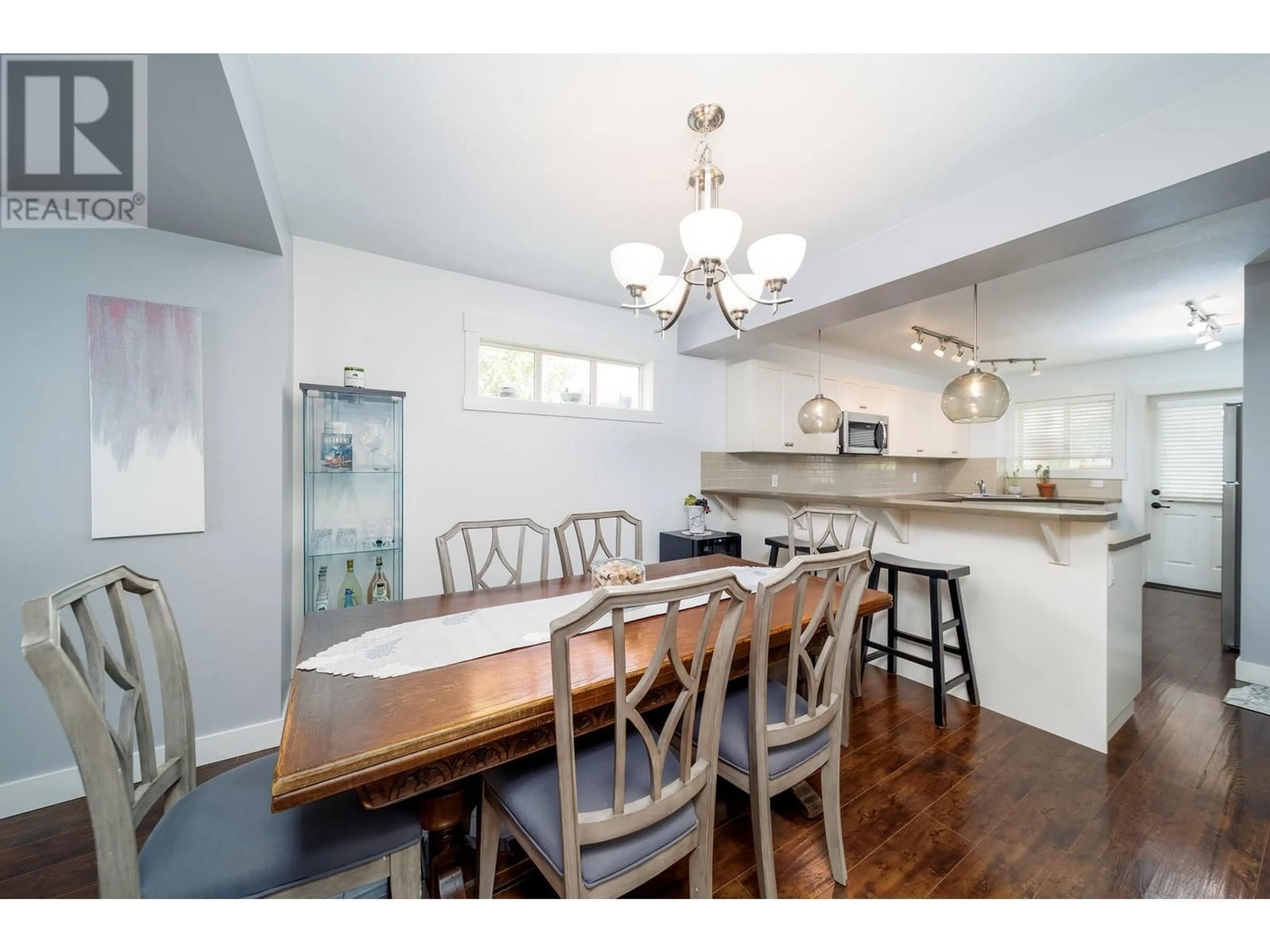 Open concept kitchen, wood/laminate floor for 154 - 1651 LYNRICK ROAD, Kelowna British Columbia V1P1R4