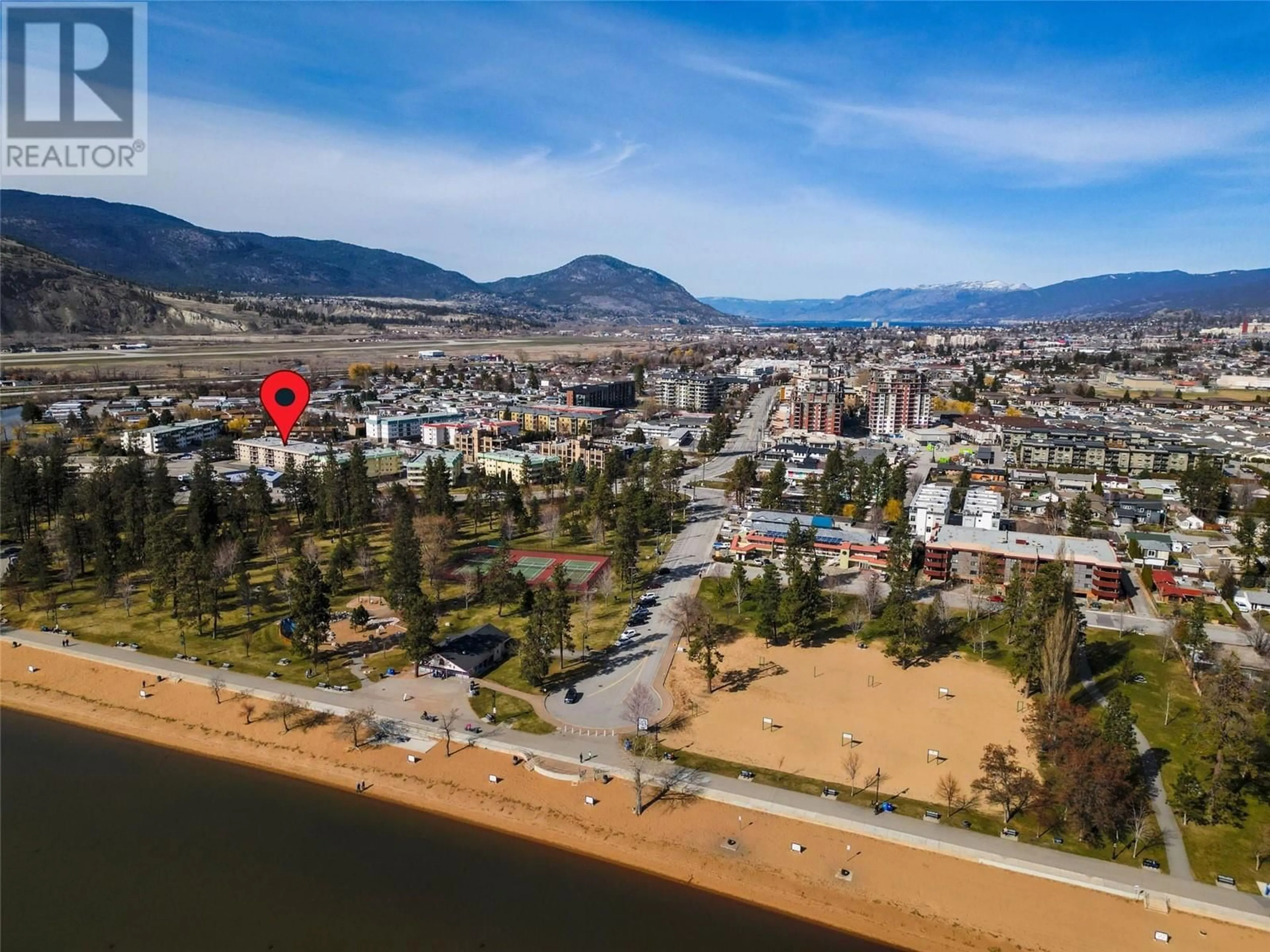 A pic from outside/outdoor area/front of a property/back of a property/a pic from drone, mountain view for 206 - 130 SKAHA PLACE, Penticton British Columbia V2A7J6