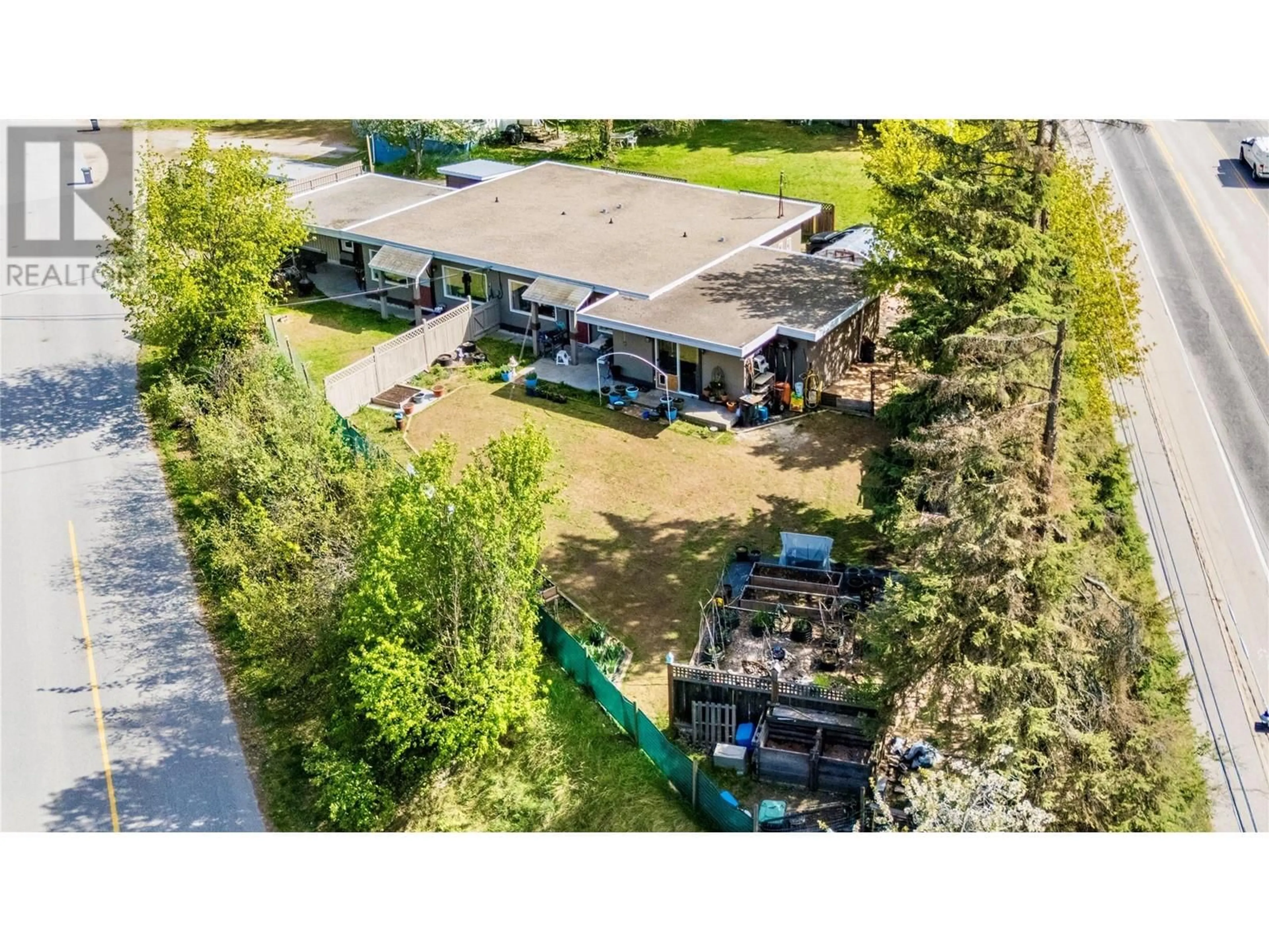 A pic from outside/outdoor area/front of a property/back of a property/a pic from drone, street for 714 12TH STREET, Castlegar British Columbia V1N2K3
