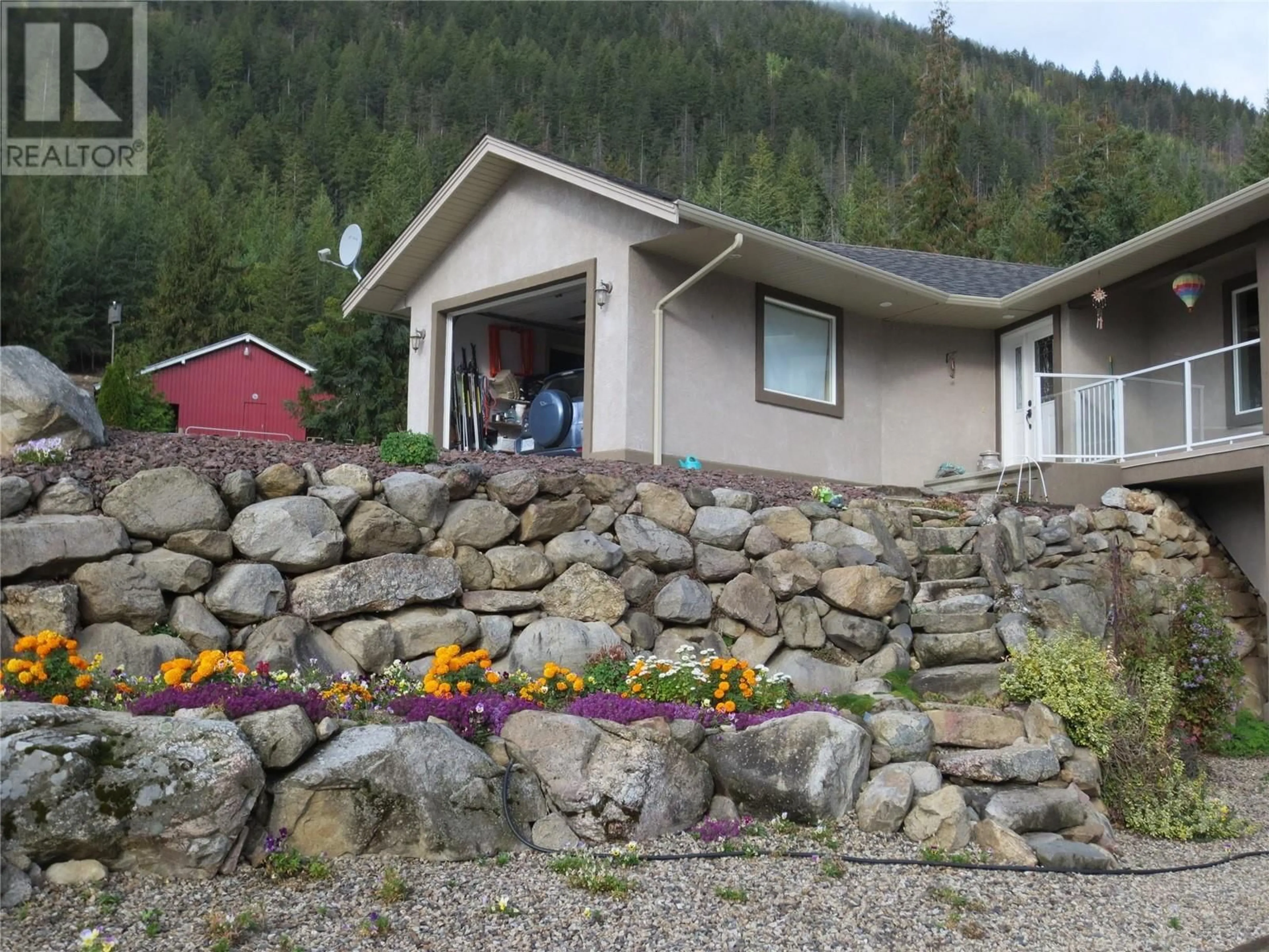 A pic from outside/outdoor area/front of a property/back of a property/a pic from drone, mountain view for 129 KAULT HILL ROAD, Salmon Arm British Columbia V1E3A3