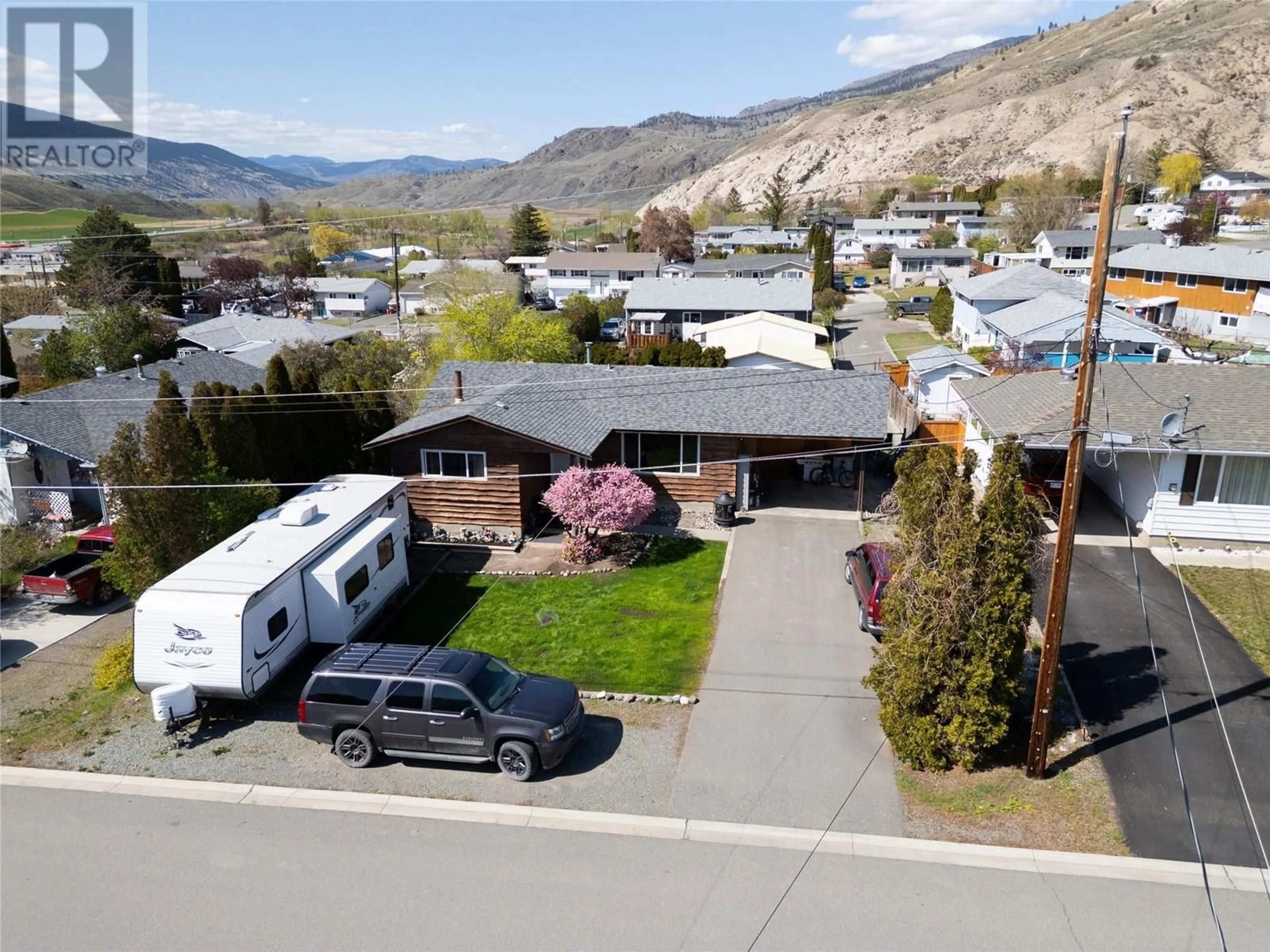 A pic from outside/outdoor area/front of a property/back of a property/a pic from drone, mountain view for 1105 MACLEAN CRESCENT, Cache Creek British Columbia V0K1H0