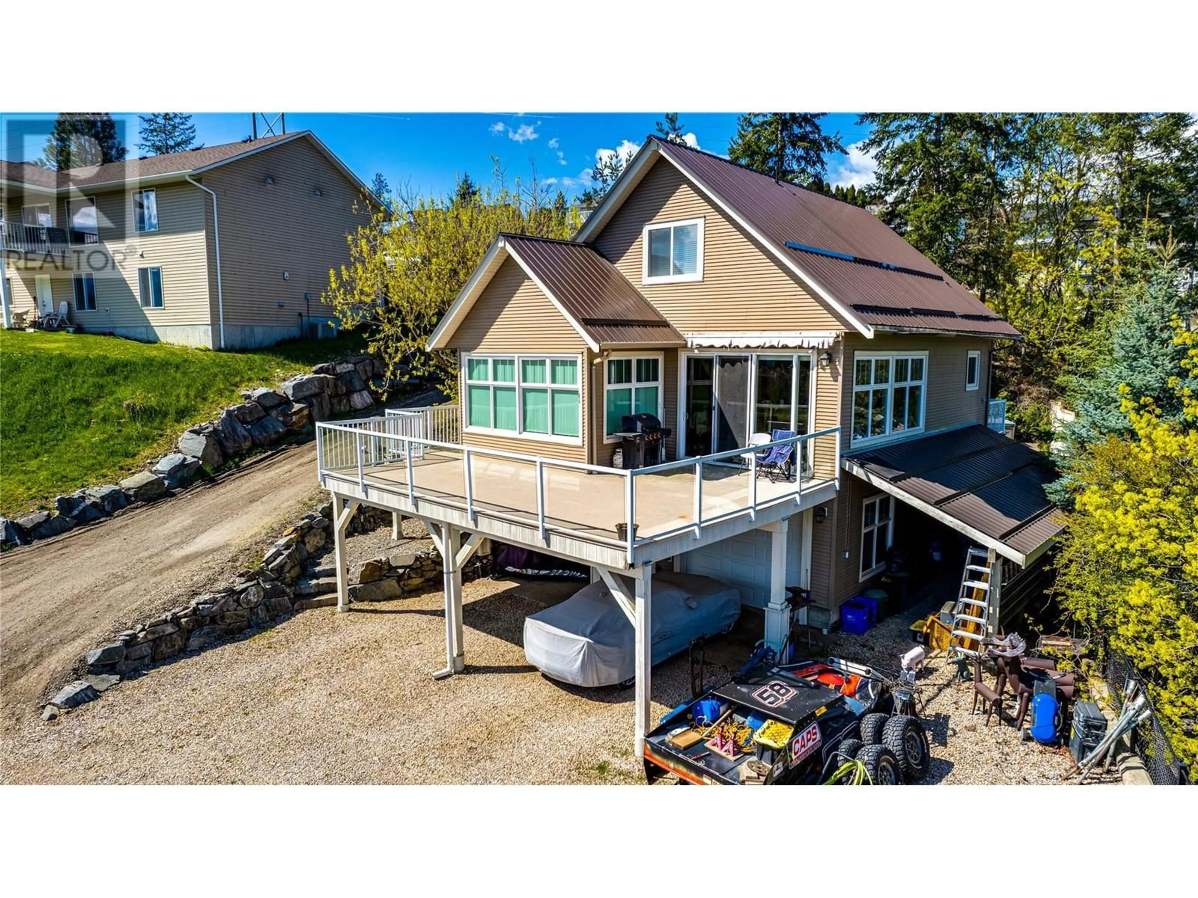 A pic from outside/outdoor area/front of a property/back of a property/a pic from drone, water/lake/river/ocean view for 1220 LAWES STREET, Enderby British Columbia V4Y4B7