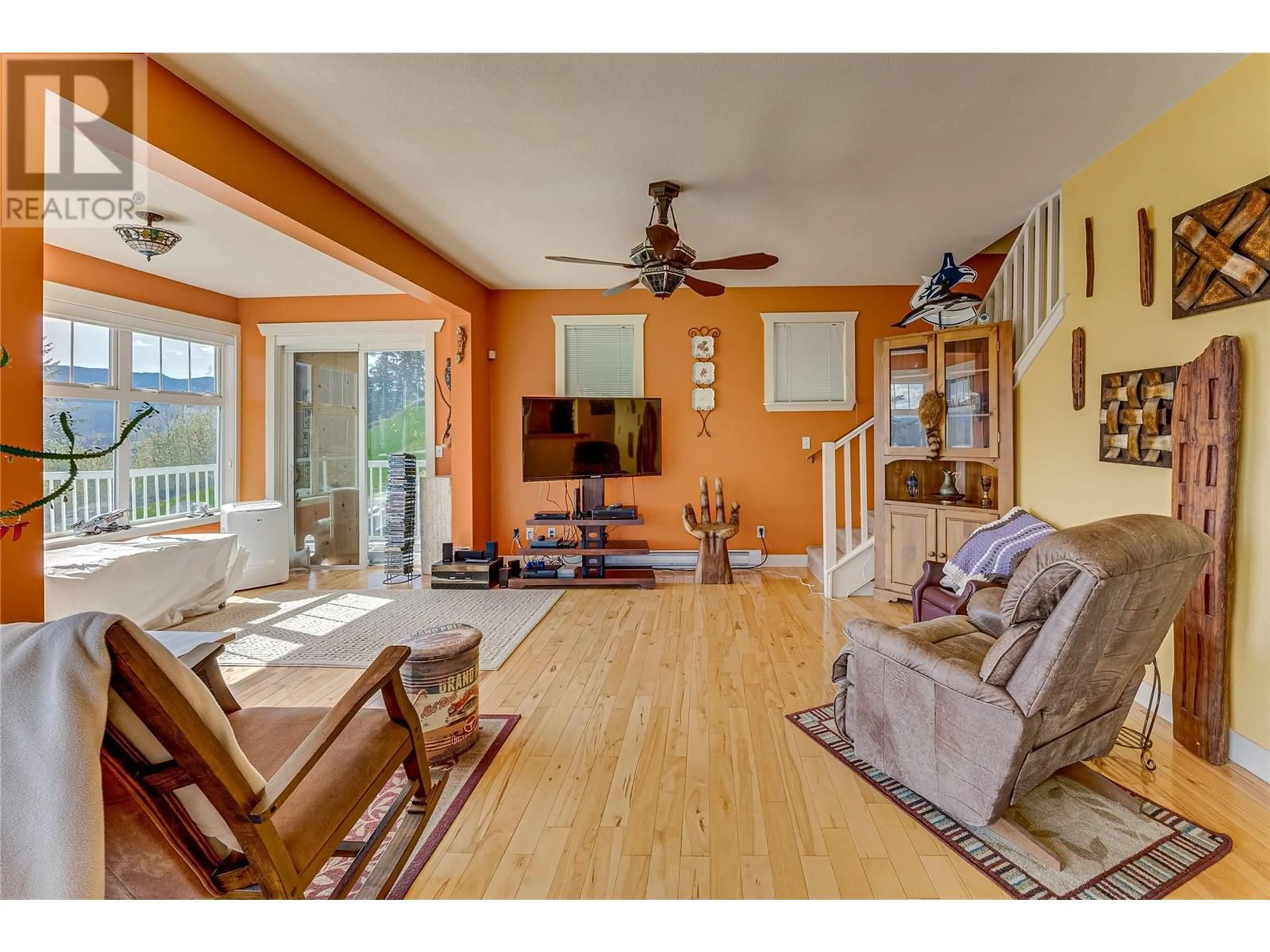 Living room with furniture, wood/laminate floor for 1220 LAWES STREET, Enderby British Columbia V4Y4B7