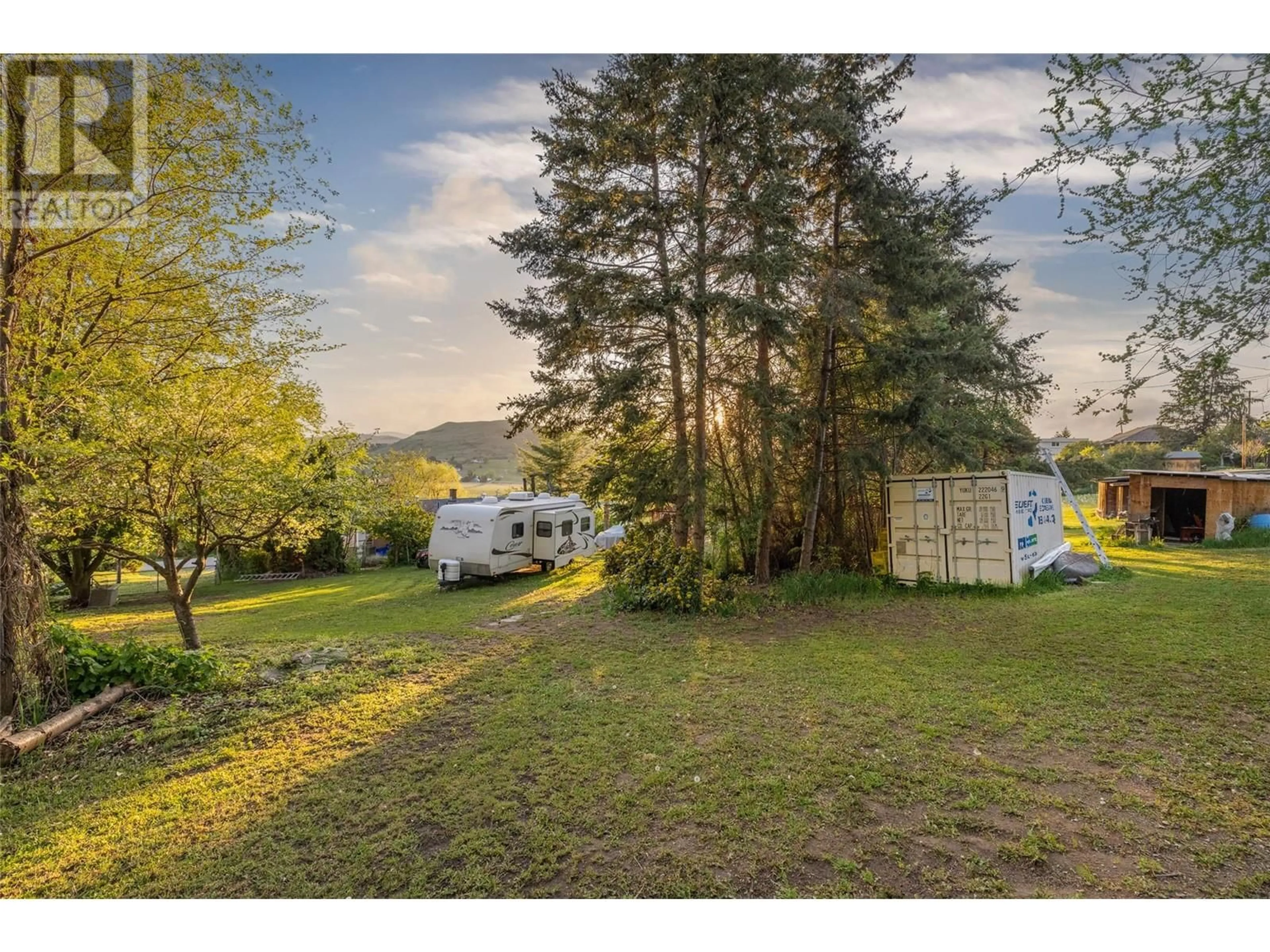 A pic from outside/outdoor area/front of a property/back of a property/a pic from drone, forest/trees view for 9549 NICKEL DRIVE, Coldstream British Columbia V1B2X1