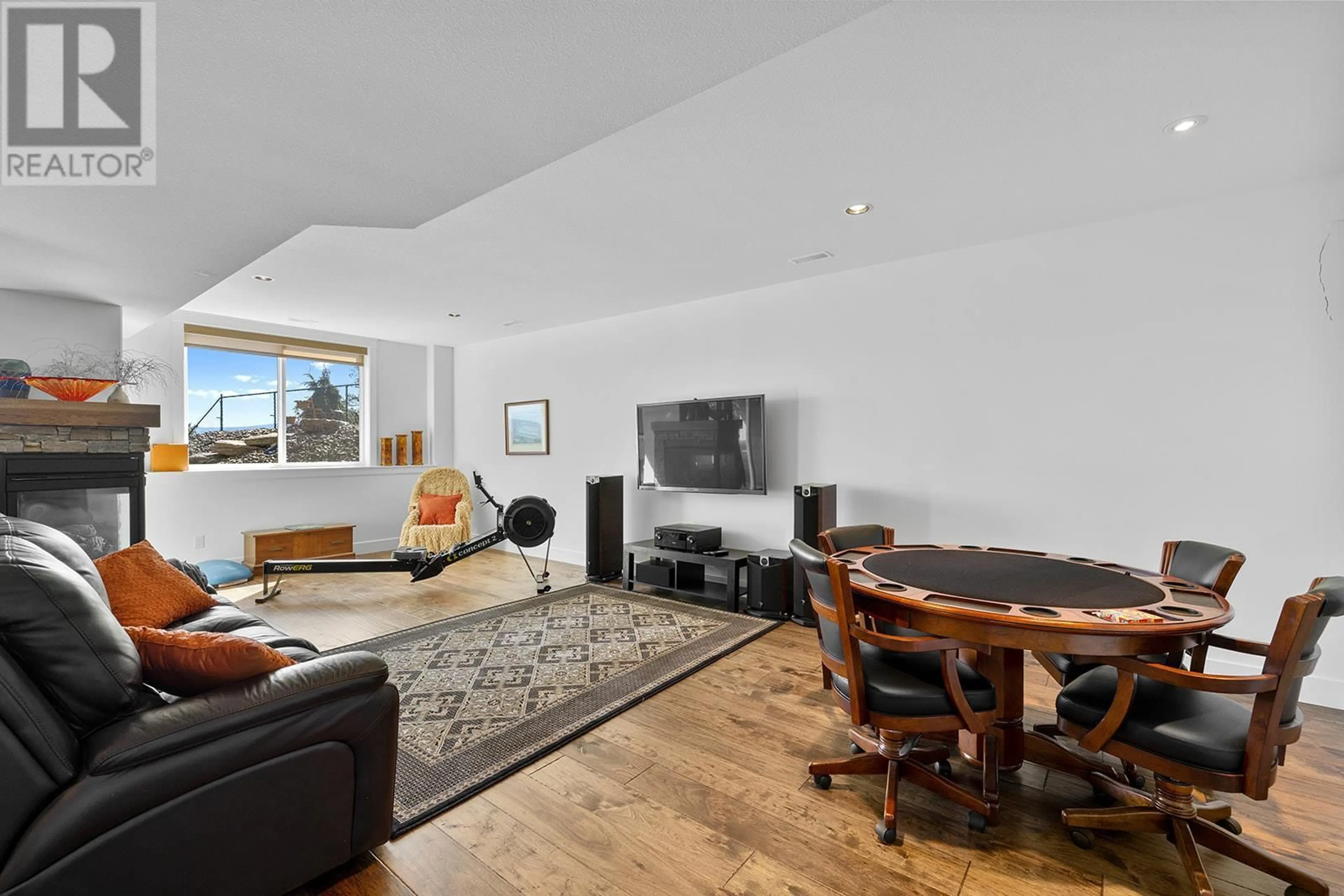 Living room with furniture, wood/laminate floor for 3104 LAKEVIEW COVE ROAD, West Kelowna British Columbia V1Z3P6