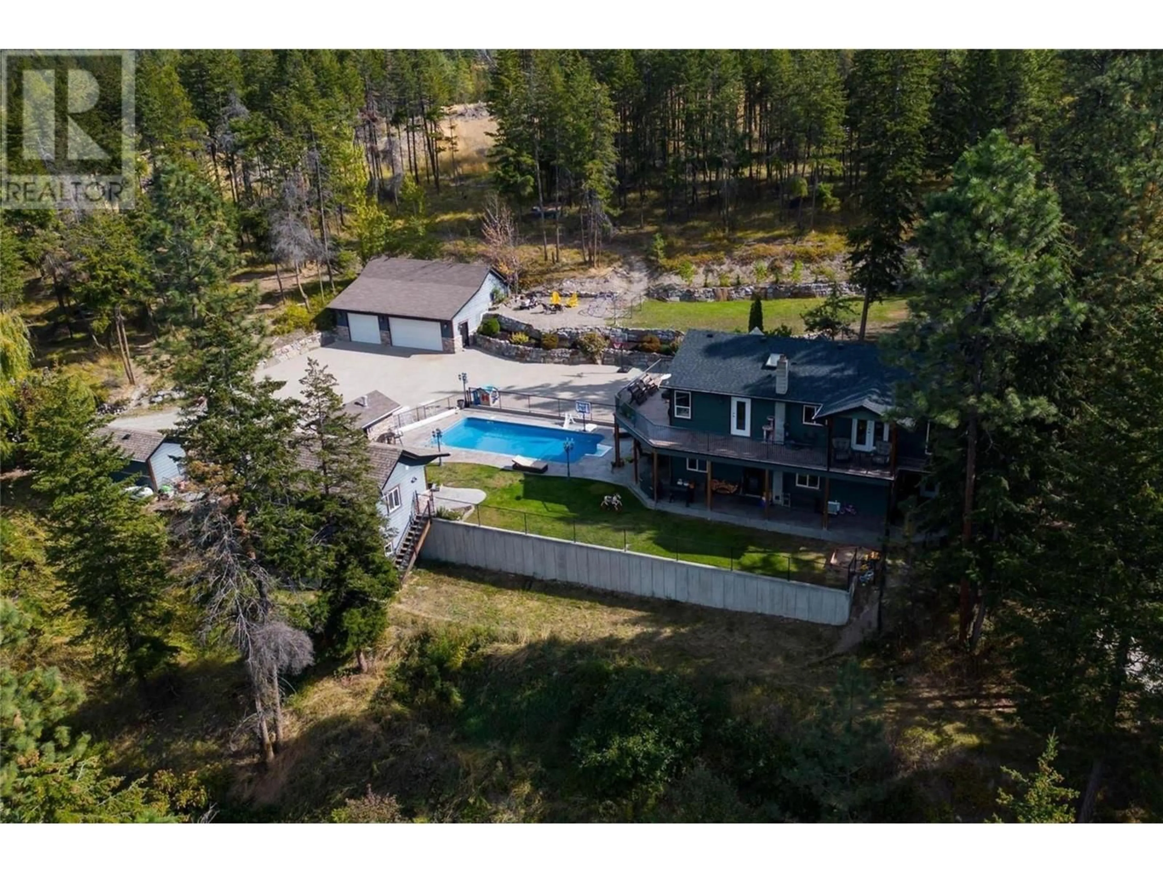 A pic from outside/outdoor area/front of a property/back of a property/a pic from drone, water/lake/river/ocean view for 4444 JUNE SPRINGS ROAD, Kelowna British Columbia V1W4C8