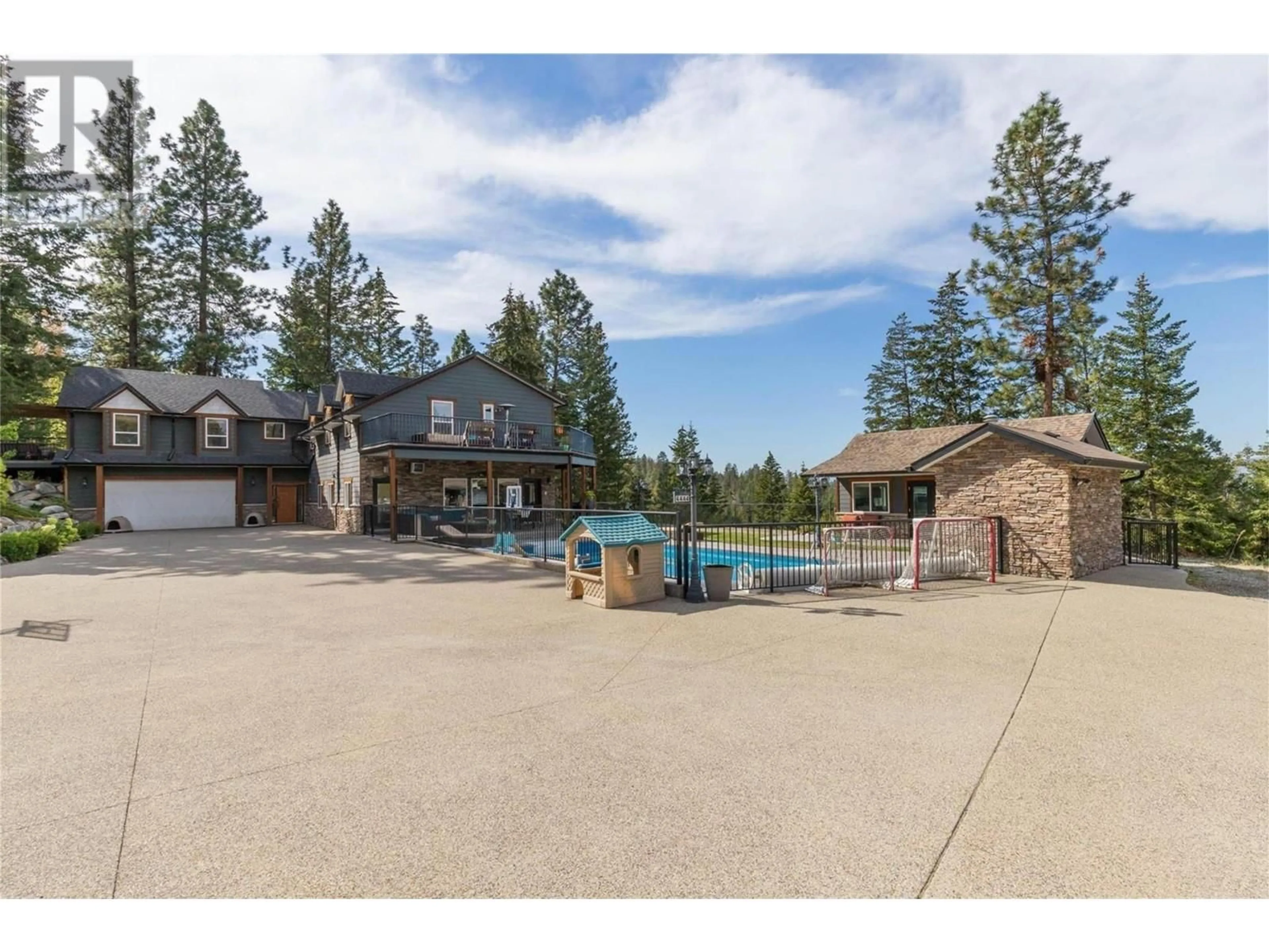 A pic from outside/outdoor area/front of a property/back of a property/a pic from drone, water/lake/river/ocean view for 4444 JUNE SPRINGS ROAD, Kelowna British Columbia V1W4C8