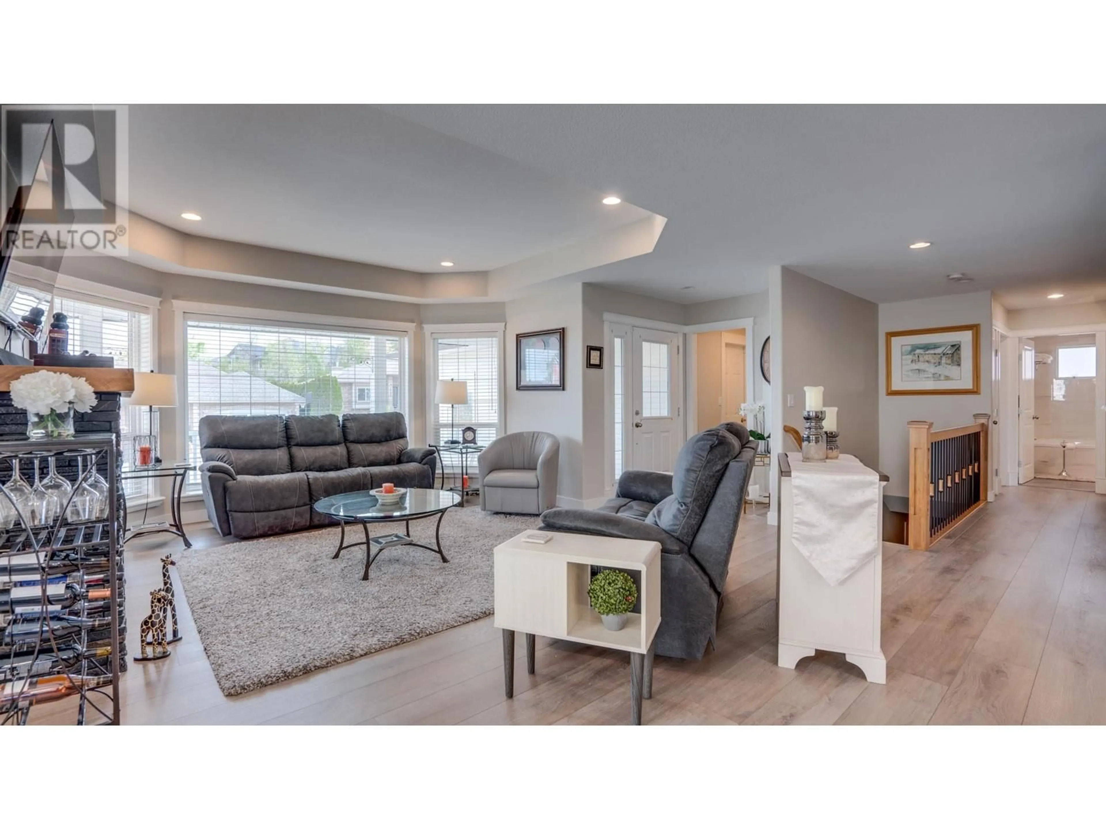 Living room with furniture, wood/laminate floor for 1025 MT BULMAN DRIVE, Vernon British Columbia V1B2Z1