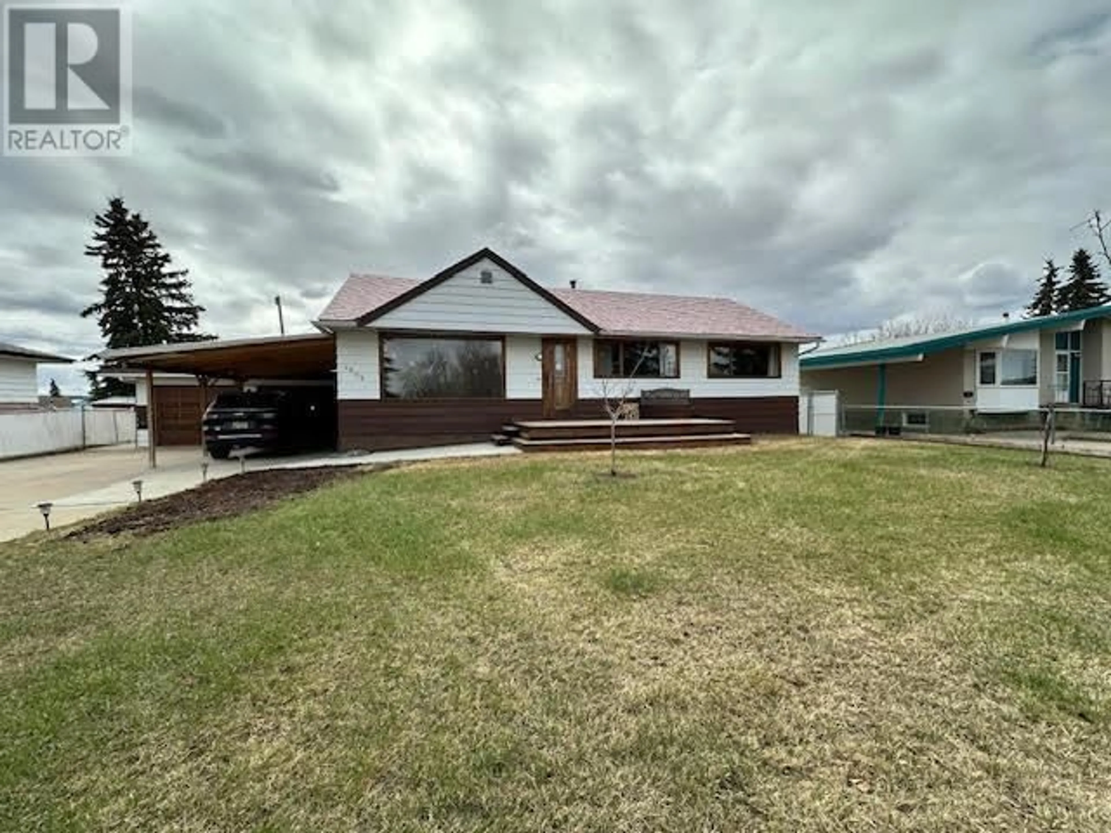A pic from outside/outdoor area/front of a property/back of a property/a pic from drone, unknown for 1509 108 AVENUE, Dawson Creek British Columbia V1G2T5