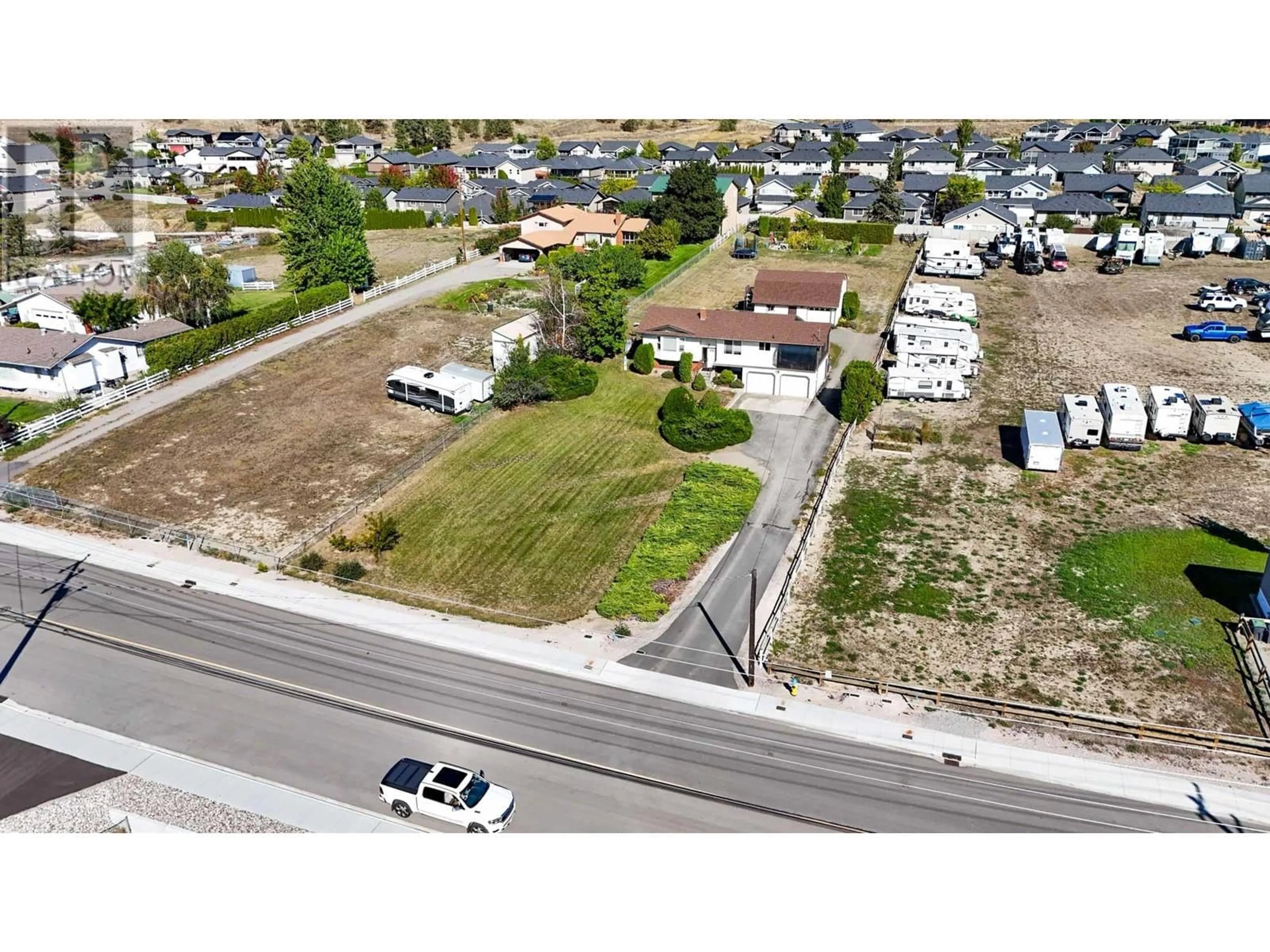 A pic from outside/outdoor area/front of a property/back of a property/a pic from drone, street for 3116 APPALOOSA ROAD, Kelowna British Columbia V1V2G9