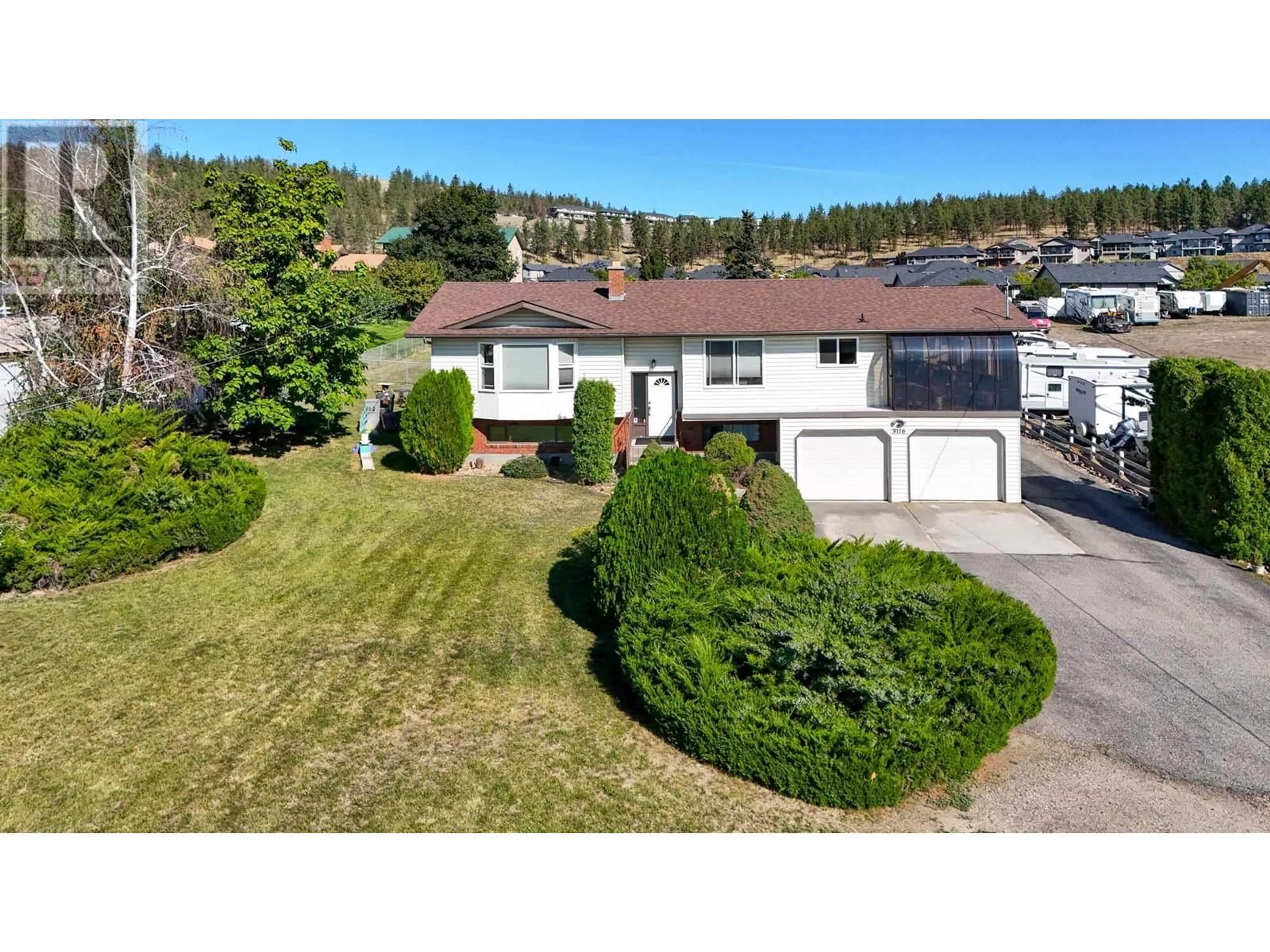 A pic from outside/outdoor area/front of a property/back of a property/a pic from drone, street for 3116 APPALOOSA ROAD, Kelowna British Columbia V1V2G9