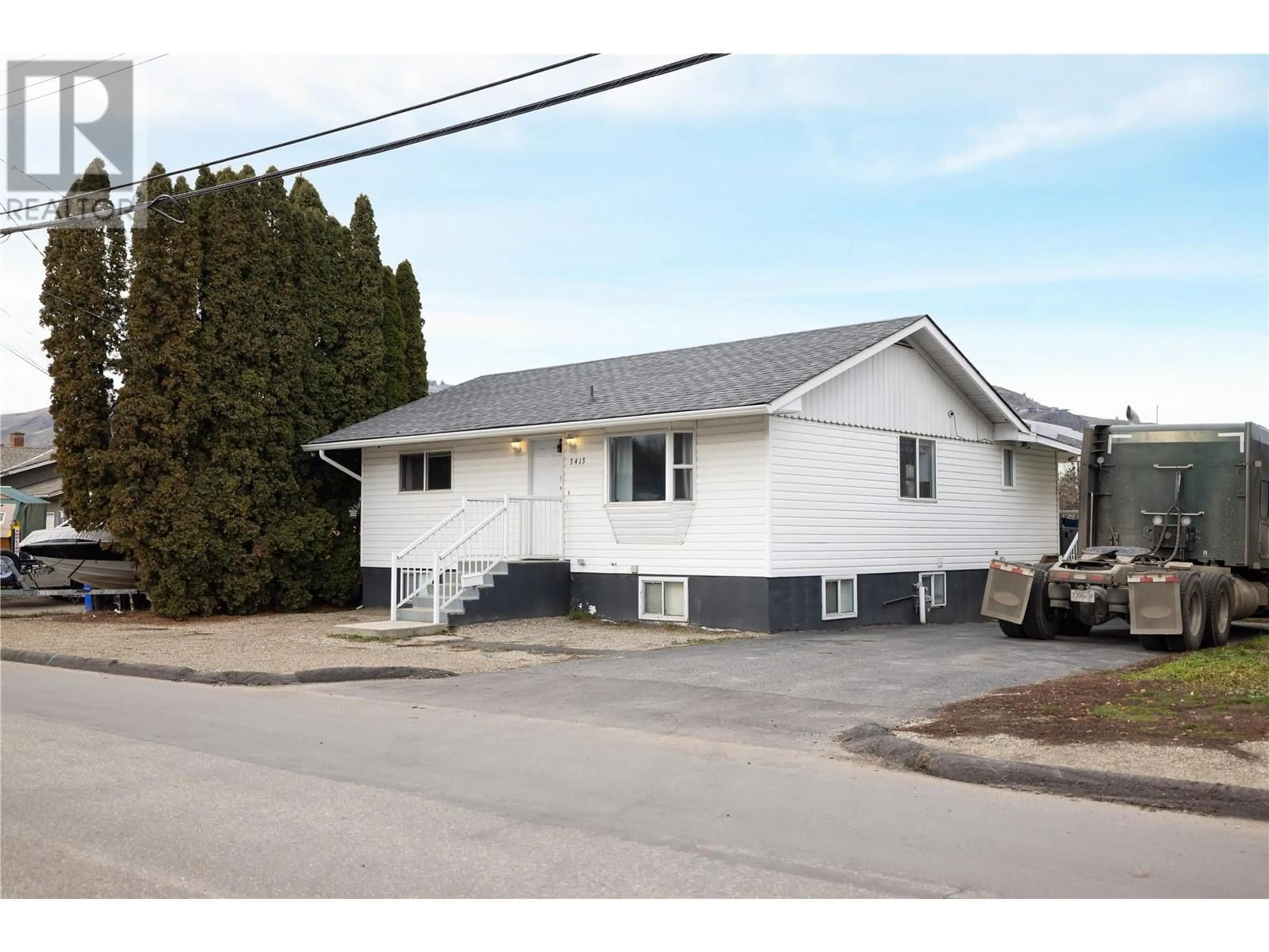 Home with vinyl exterior material, street for 3413 24 AVENUE, Vernon British Columbia V1T1L7