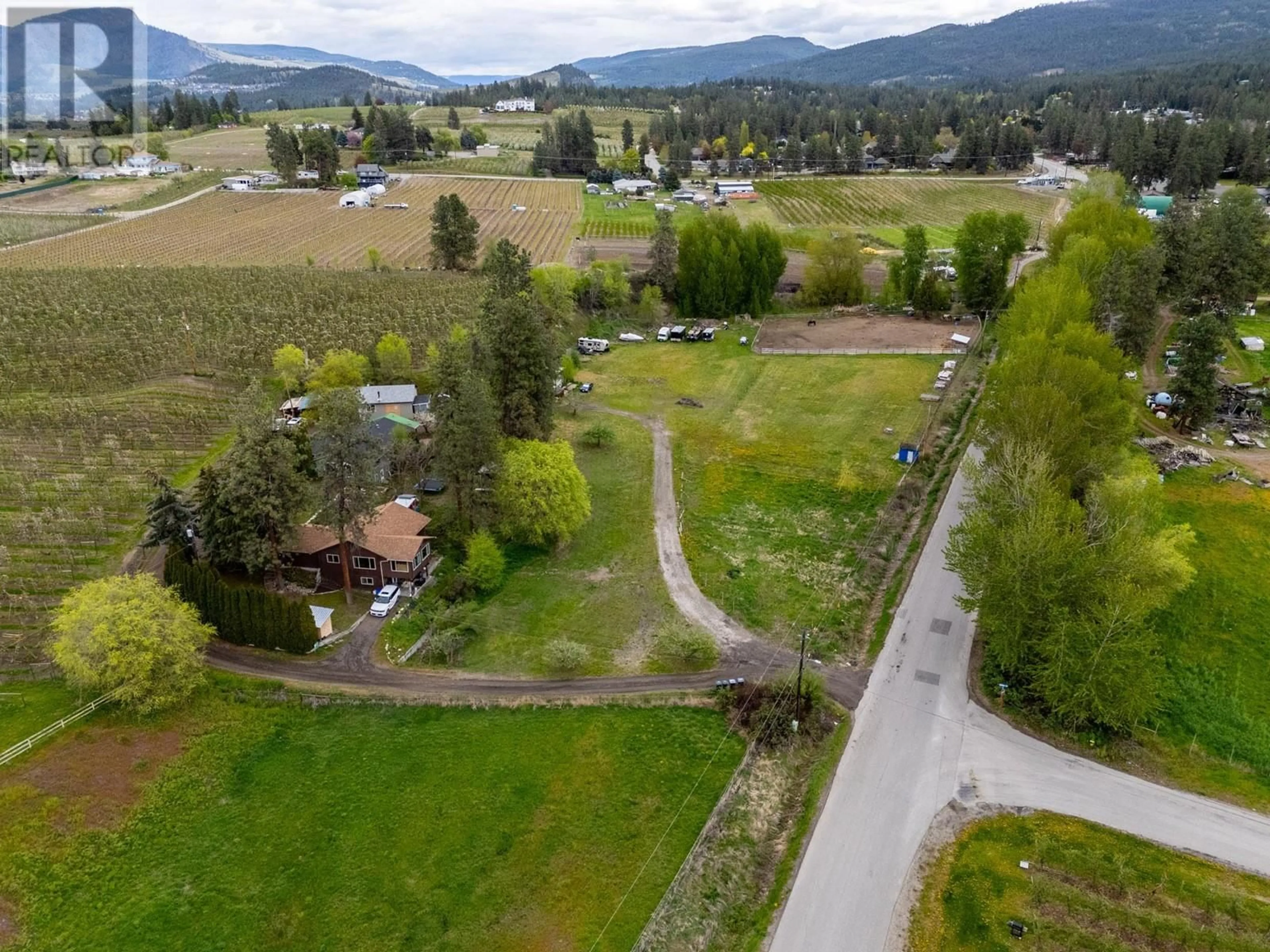 A pic from outside/outdoor area/front of a property/back of a property/a pic from drone, mountain view for 3060 GULLEY ROAD, Kelowna British Columbia V1W4E5